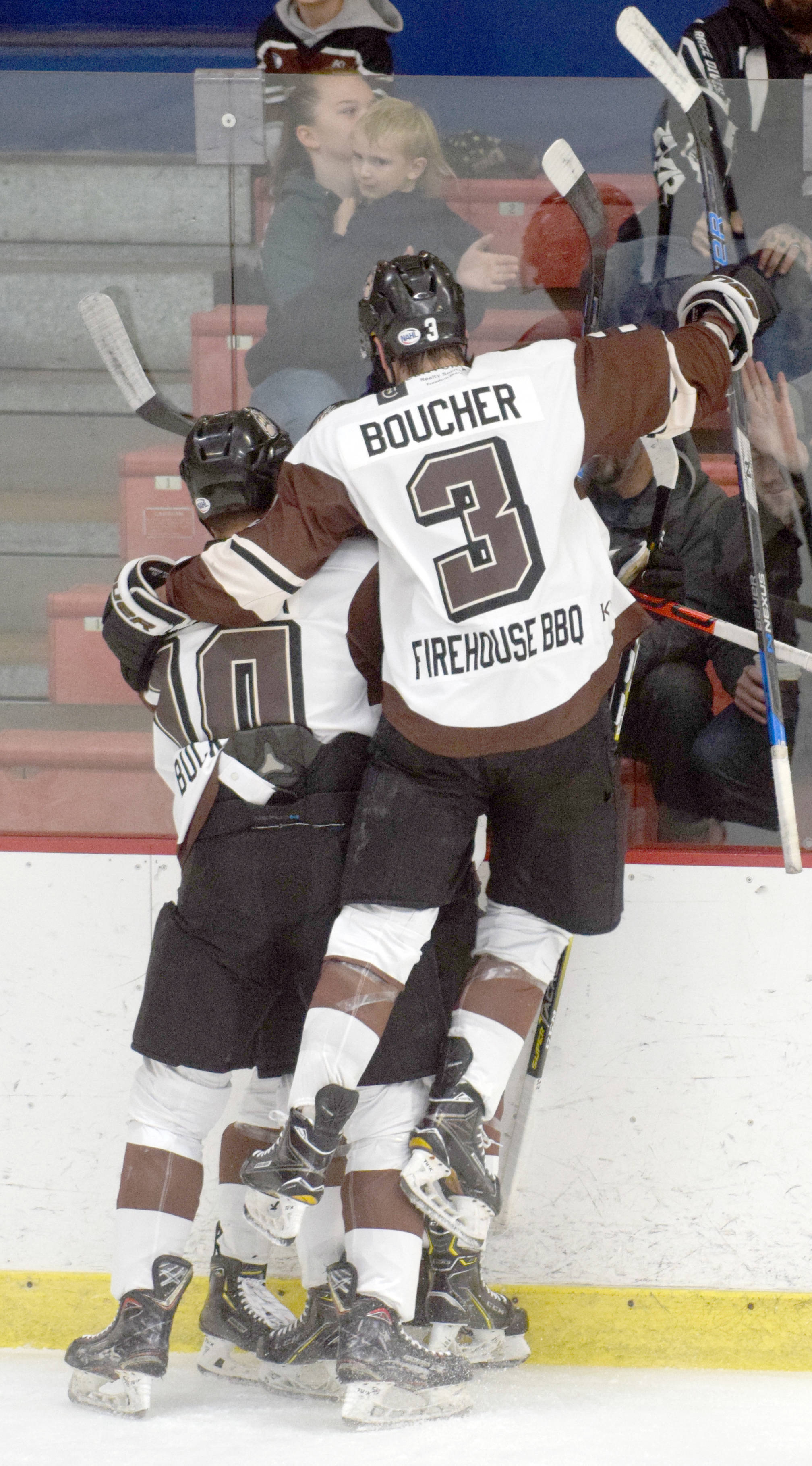 JJ Boucher jumps on teammates to celebrate Max Helgeson’s goal in the first period against the Janesville (Wisconsin) Jets on Friday, Oct. 21, 2019, at the Soldotna Regional Sports Complex in Soldotna, Alaska. (Photo by Jeff Helminiak/Peninsula Clarion)