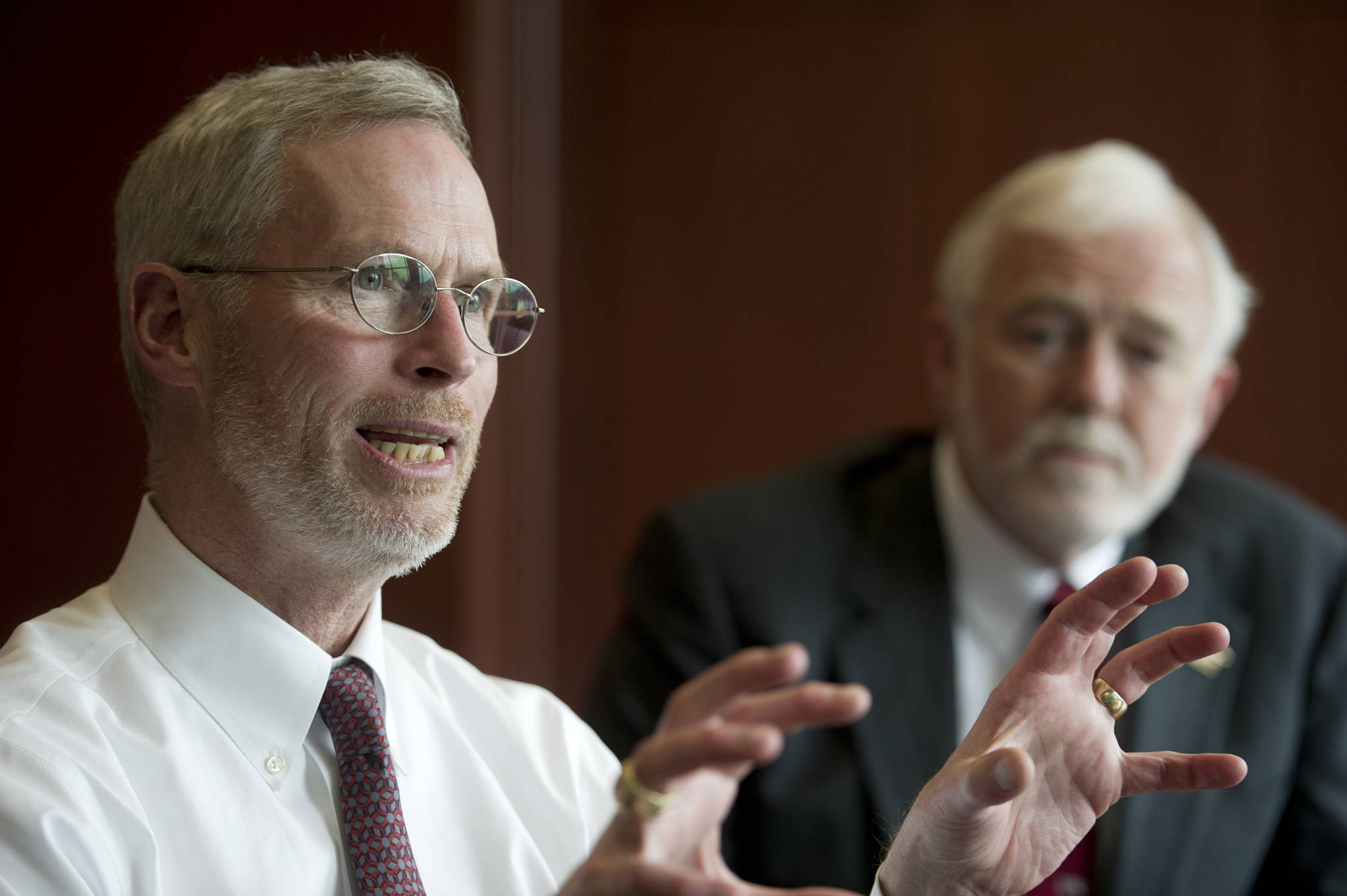 In this Empire file photo, University of Alaska President Jim Johnsen, left, speaks during an interview at the Juneau Empire in April 2016. Attending the interview with Johnsen is University of Alaska Southeast Chancellor Rick Caulfield. (Michael Penn | Juneau Empire File)