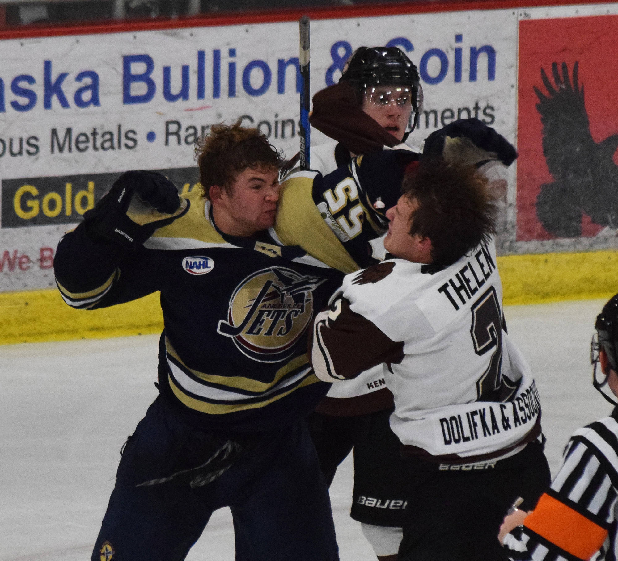 Janesville’s Grant Hindman (left) engages Kenai River’s Nate Thelen in a fight late in the second period Saturday, Oct. 12, 2019, at the Soldotna Regional Sports Complex in Soldotna, Alaska. (Photo by Joey Klecka/Peninsula Clarion)