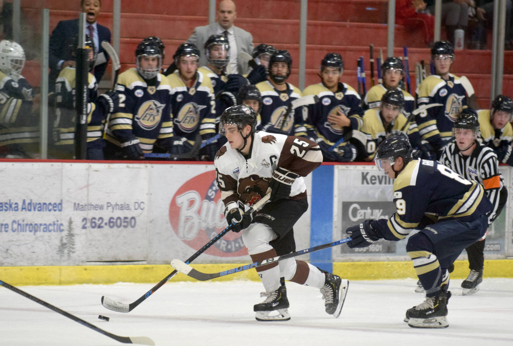 Kenai River Brown Bears defenseman Preston Weeks moves the puck up the ice against the Janesville (Wisconsin) Jets on Friday, Oct. 11, 2019, at the Soldotna Regional Sports Complex in Soldotna, Alaska. (Photo by Jeff Helminiak/Peninsula Clarion)