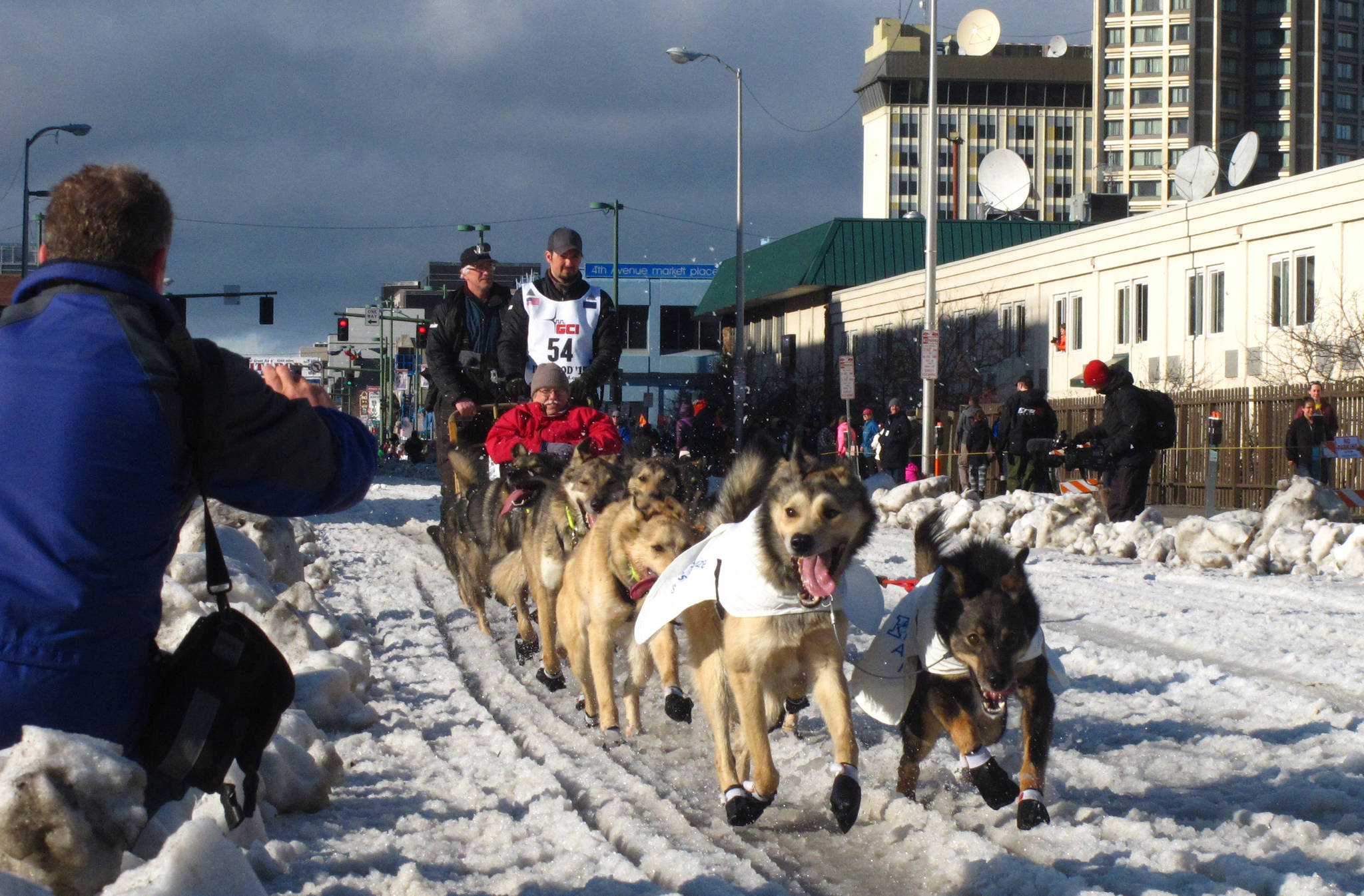 In this March 7, 2015, file photo, musher Peter Kaiser, of Bethel, Alaska, leads his team past spectators during the ceremonial start of the Iditarod Trail Sled Dog Race, in Anchorage, Alaska. PETA is the biggest critic of the world’s most famous sled dog race, but new Iditarod CEO Rob Urbach has started discussions with the animal rights group and plans a sit-down meeting with PETA, Thursday, Oct. 17, 2019, in Los Angeles. (AP Photo/Rachel D’Oro, File)