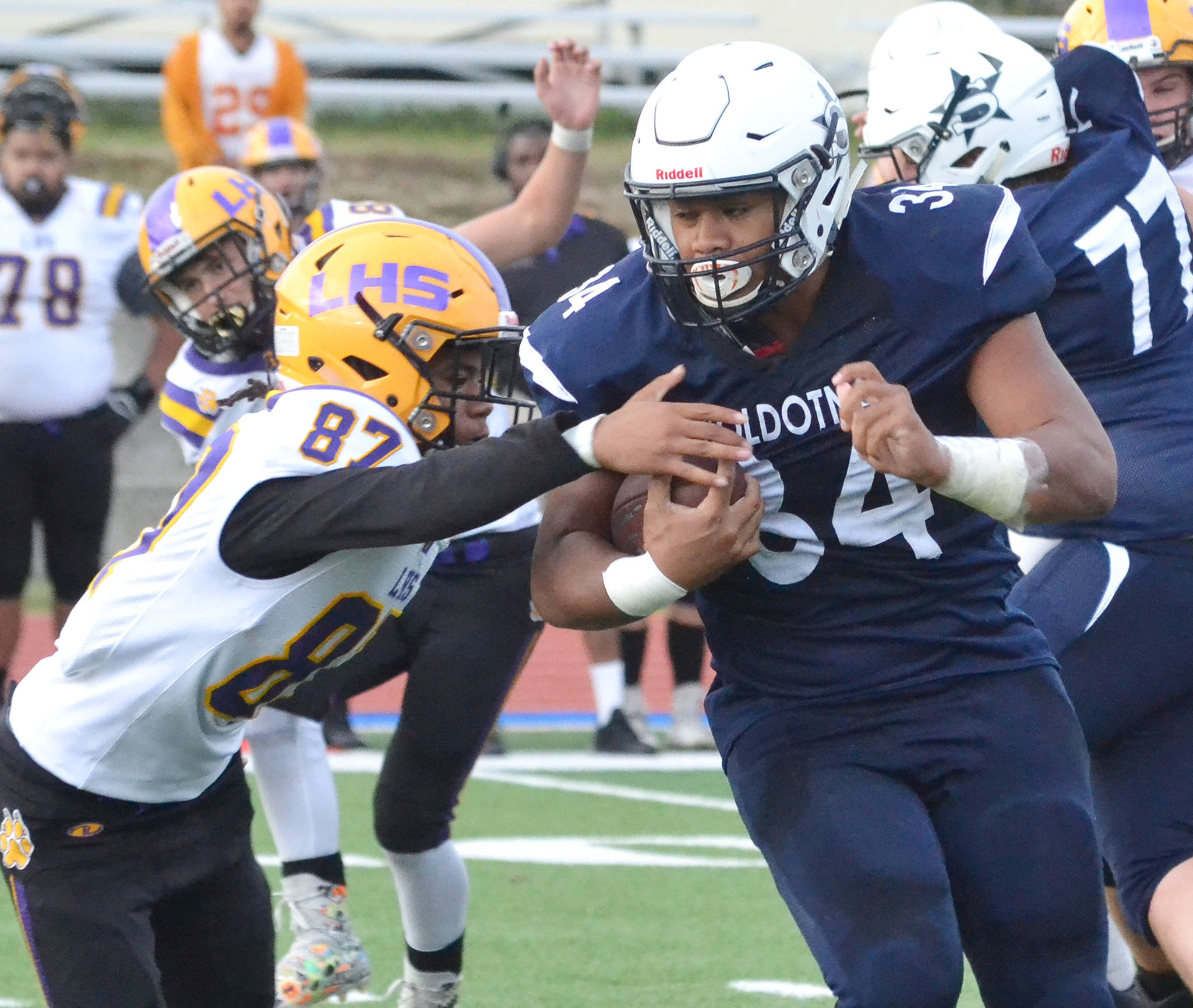 Soldotna’s Aaron Faletoi (right) shakes off the tackle of Lathrop’s Jamaal Blanchard-Davis Friday, Sept. 13, 2019, at Justin Maile Field in Soldotna, Alaska. (Photo by Joey Klecka/Peninsula Clarion)