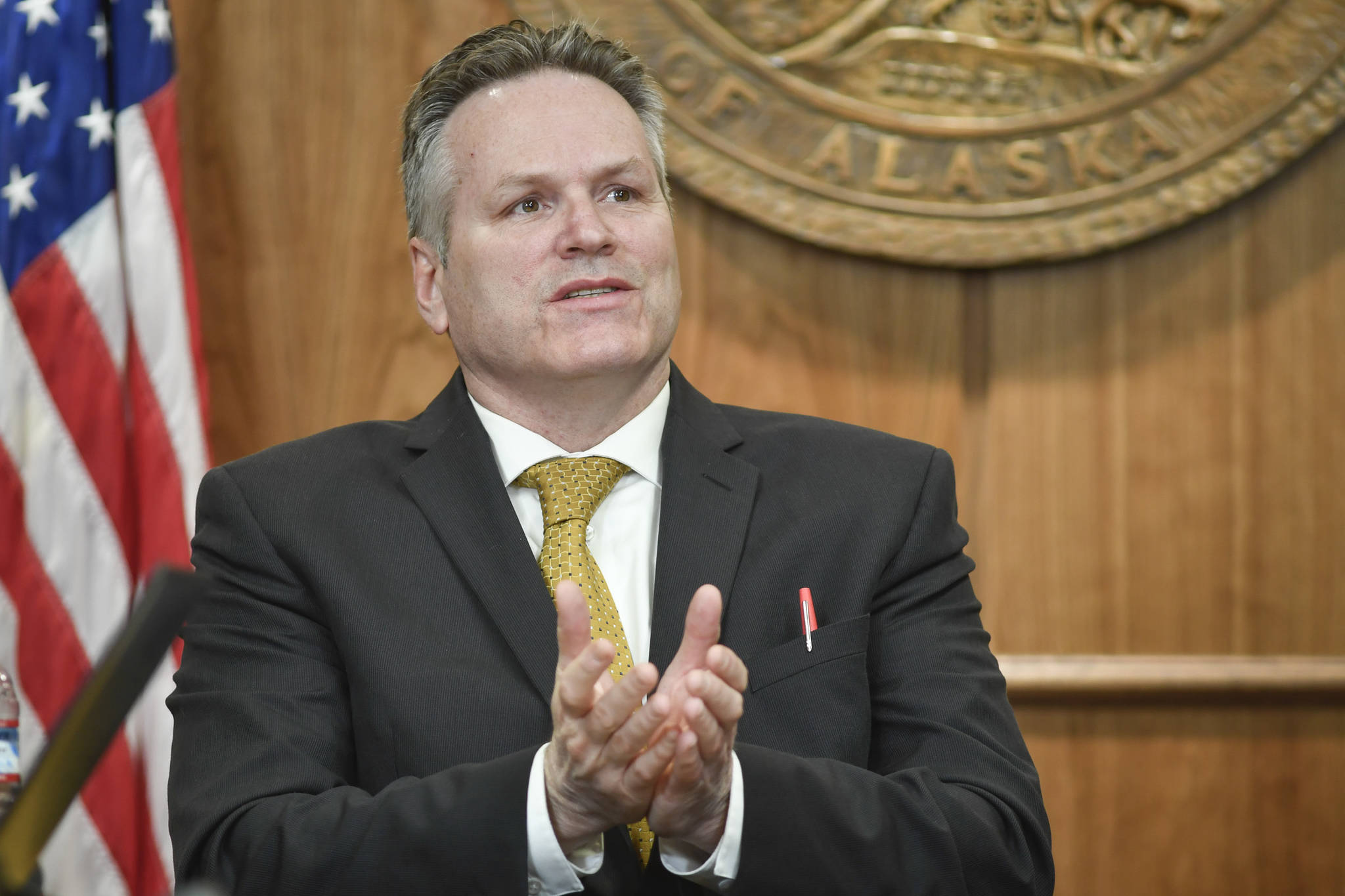 Gov. Mike Dunleavy holds a press conference at the Capitol in this April 2019 photo. His speech at the Alaska Federation of Natives conference Thursday included a commitment to a smoother budget process in 2020. (Michael Penn | Juneau Empire)