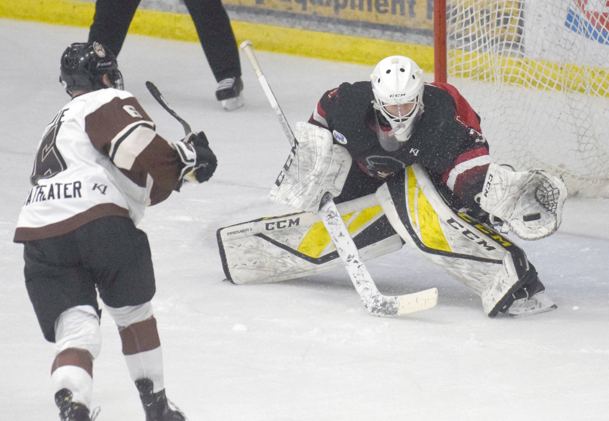 Minnesota Magicians goalie Wes Mankowski makes a save on Kenai River Brown Bears forward Brandon Lajoie during the shootout Friday, Oct. 18, 2019, at the Soldotna Regional Sports Complex in Soldotna, Alaska. (Photo by Jeff Helminiak/Peninsula Clarion)