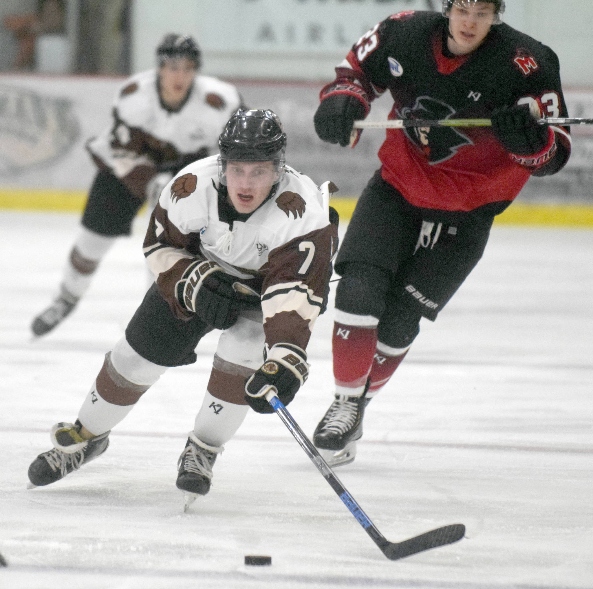 Kenai River Brown Bears forward Logan Ritchie reaches for the puck against the Minnesota Magicians on Friday, Oct. 18, 2019, at the Soldotna Regional Sports Complex in Soldotna, Alaska. (Photo by Jeff Helminiak/Peninsula Clarion)