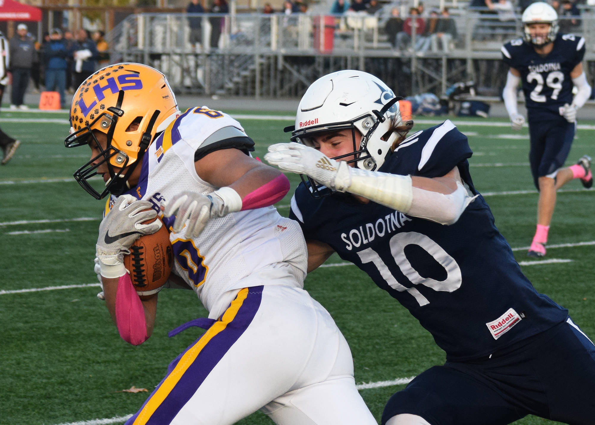 Soldotna’s Zach Hanson gets his hands on Lathrop’s Tyriq Luke on a reception Saturday, Oct. 19, 2019, at the Div. II state football championship at Anchorage Football Stadium in Anchorage, Alaska. (Photo by Joey Klecka/Peninsula Clarion)