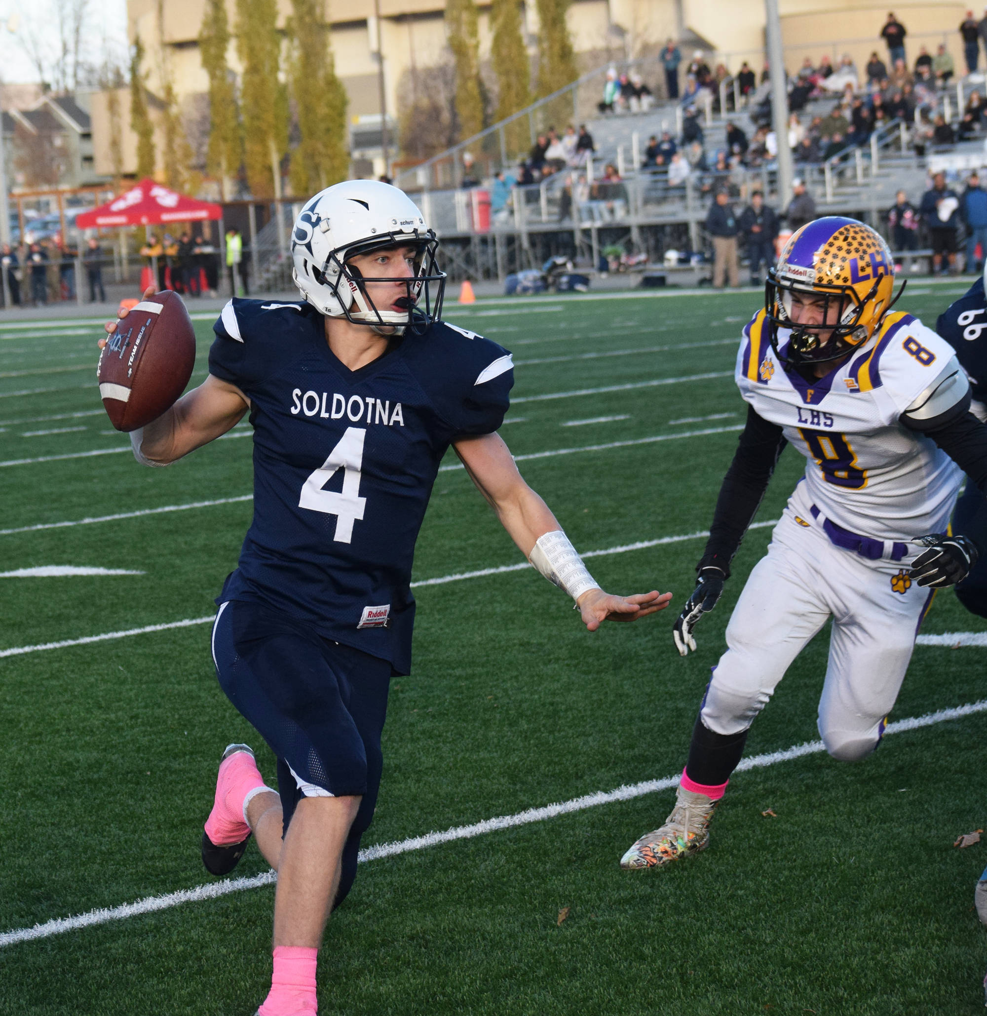 Soldotna’s Jersey Truesdell looks for an open receiver Saturday, Oct. 19, 2019, against Lathrop at the Div. II state football championship at Anchorage Football Stadium in Anchorage, Alaska. (Photo by Joey Klecka/Peninsula Clarion)