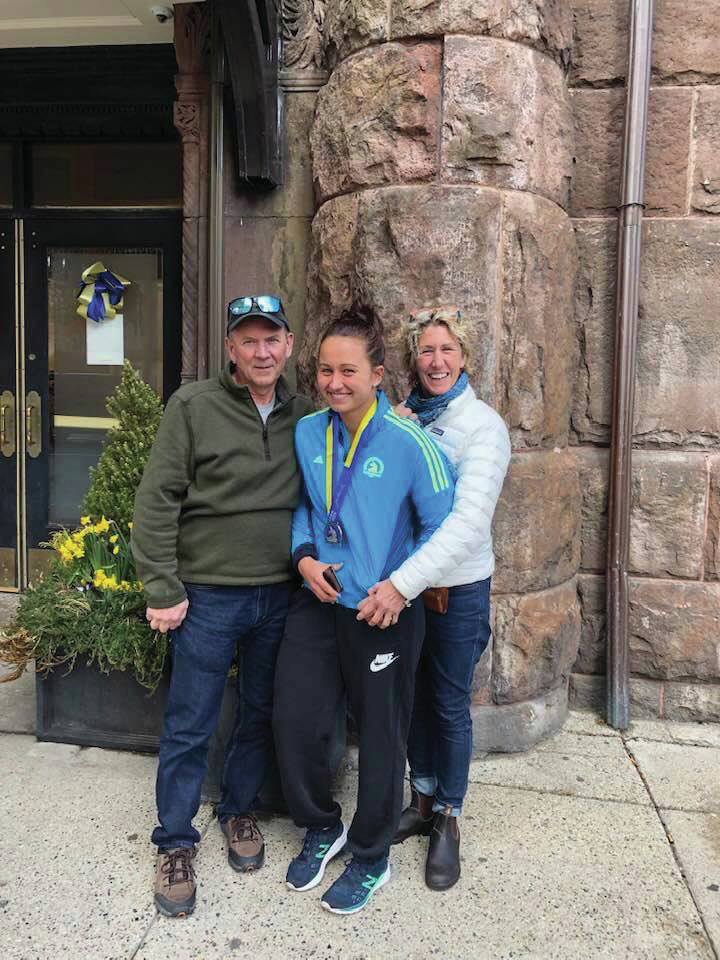 Lauren Kuhns, center, poses with her father, Lary Kuhns, left, and mother, Bridget Kuhns, right, after finishing the 2019 Boston Marathon, held April 15, 2019, in Boston. (Photo provided)