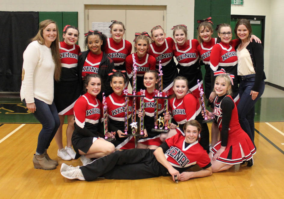 The Kenai Central cheerleading squad, back row (left to right): Coach Brianna Force, Alissa Maw, Emilee Braun, Captain Rileigh Pace, Karley Harden, Katie Stockton, Malena Grieme, Co-captain Keelin McGraw, Alida Stiers, Assistant Coach Tavia Vaughn. Middle row: Arielle Hamar, Dulce Santana, Co-captain Nia Calvert, Delaney Duck, Cali Holmes. Front row: Samuel Ward. (Photo by Kelly Harden)