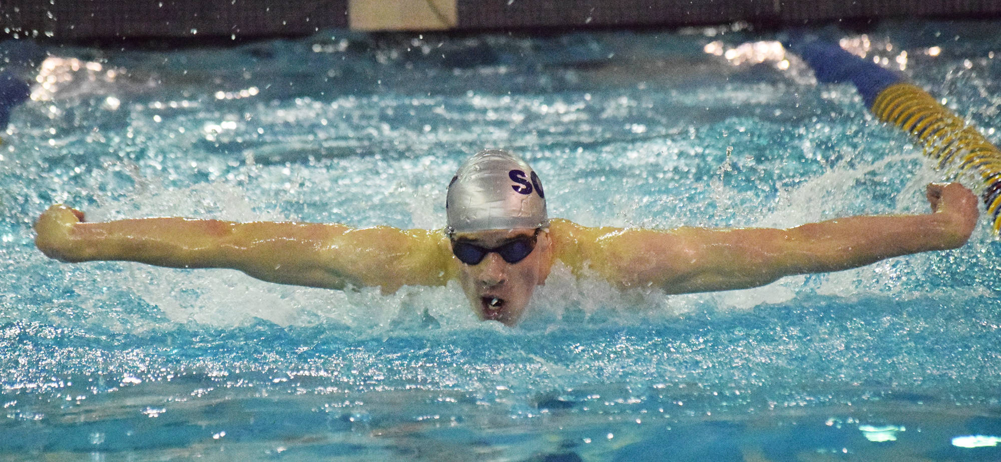 Soldotna’s Ethan Evans competes in the boys 100-yard butterfly final Nov. 3, 2018, at the Northern Lights Conference championship swim meet at Homer High School. (Photo by Joey Klecka/Peninsula Clarion)