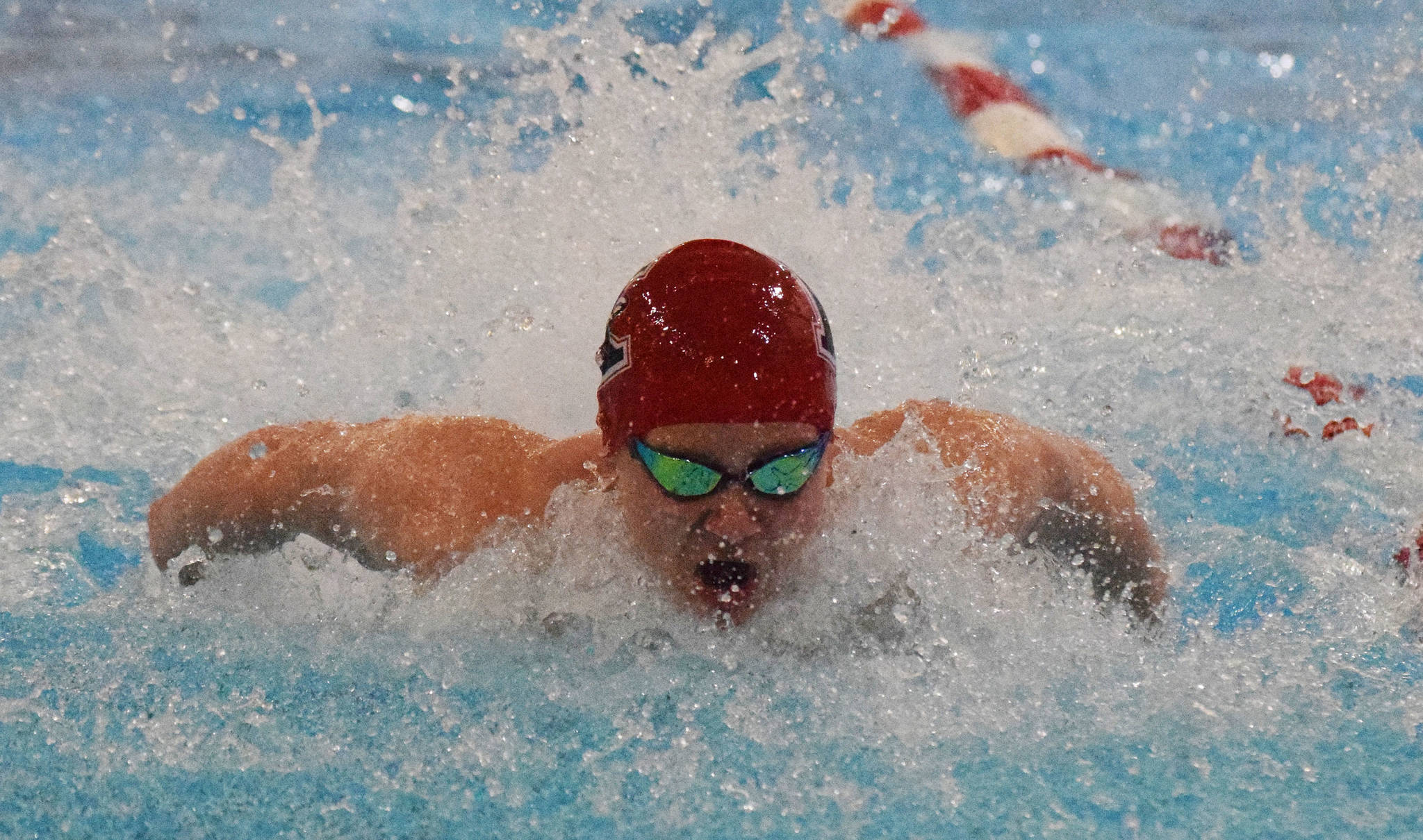 Kenai’s Owen Rolph races in the boys 100-yard butterfly Saturday, Nov. 2, 2019, at the Northern Lights Conference swimming and diving championships at Kenai Central High School. (Photo by Joey Klecka/Peninsula Clarion)