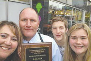 Dan Beck, center, Alaska assistant principal of the year, poses with his award in this undated photo. (Photo courtesy of Kenai Peninsula Borough School District)