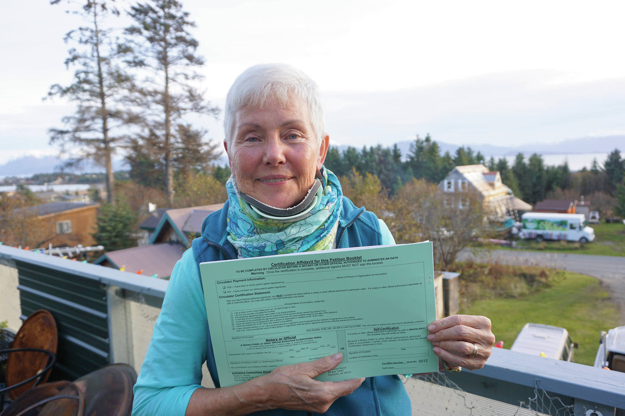 Michael Armstrong / Homer News                                Fair Share Act sponsor Jane Angvik holds an initiative petition booklet she delivered to Homer on Oct. 25.