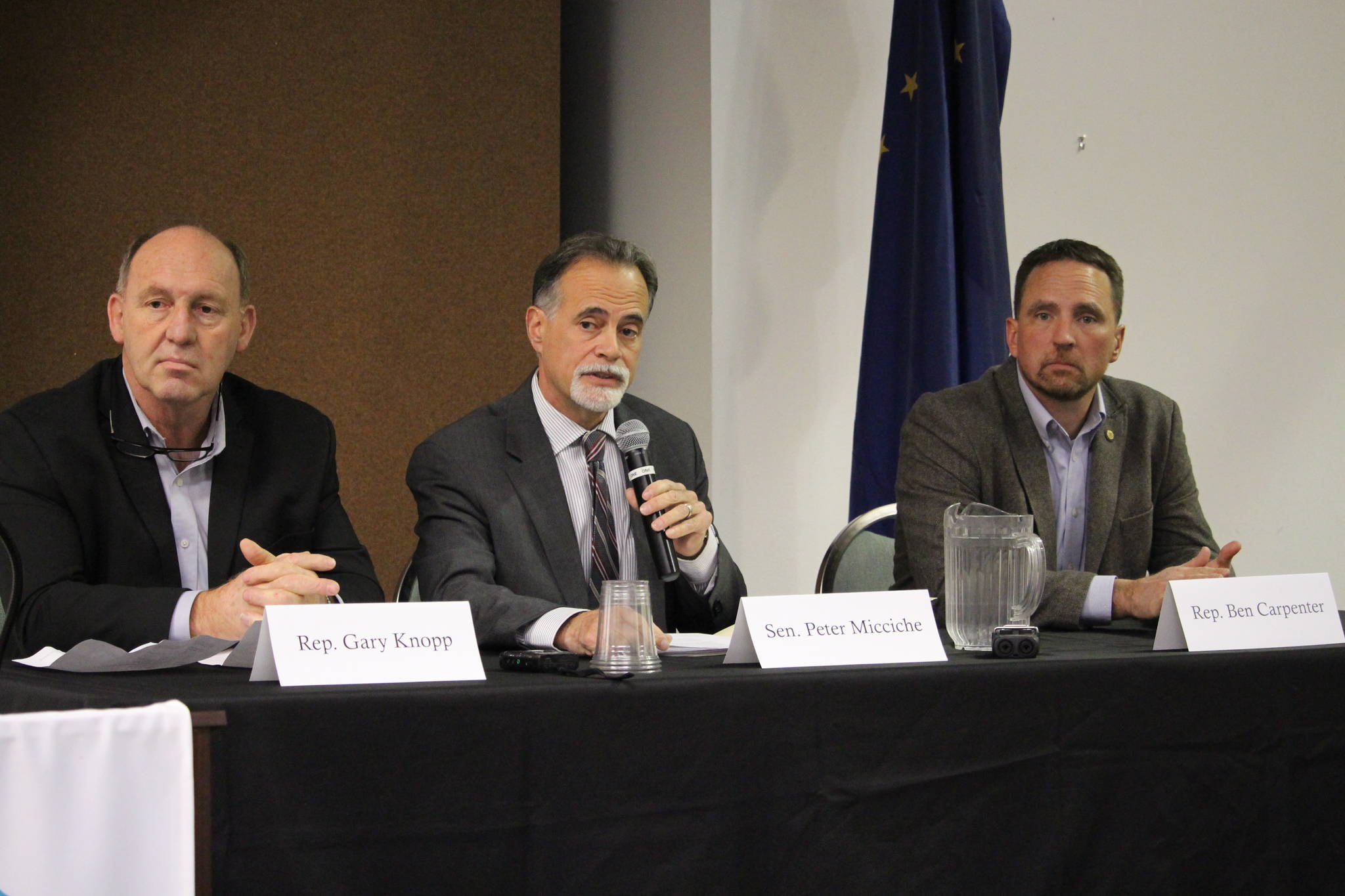 Rep. Gary Knopp, R-Soldotna, Sen. Peter Micciche, R- Soldotna and Rep. Ben Carpenter, R-Nikiski, speak to members of the Kenai and Soldotna Chambers of Commerce at the Kenai Visitor’s Center on Nov. 6, 2019. (Photo by Brian Mazurek/Peninsula Clarion)