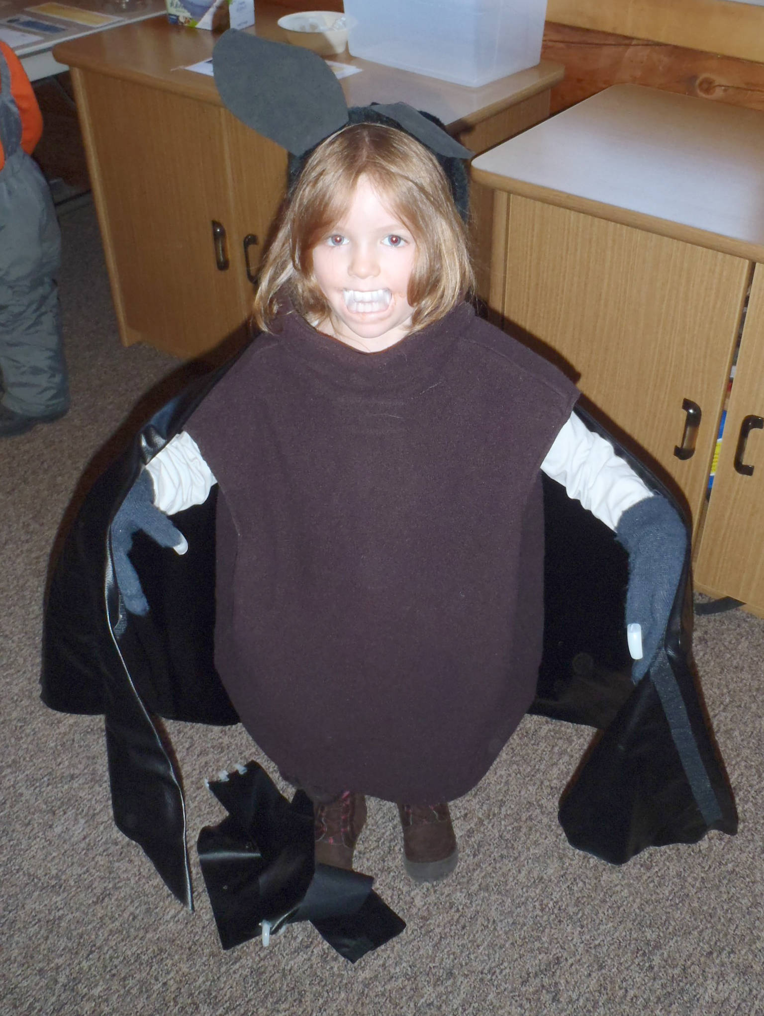 A brave volunteer dressed up in a bat costume to help peers visualize the anatomy of a bat resulted in an unusual question. (Photo provided by Kenai National Wildlife Refuge)