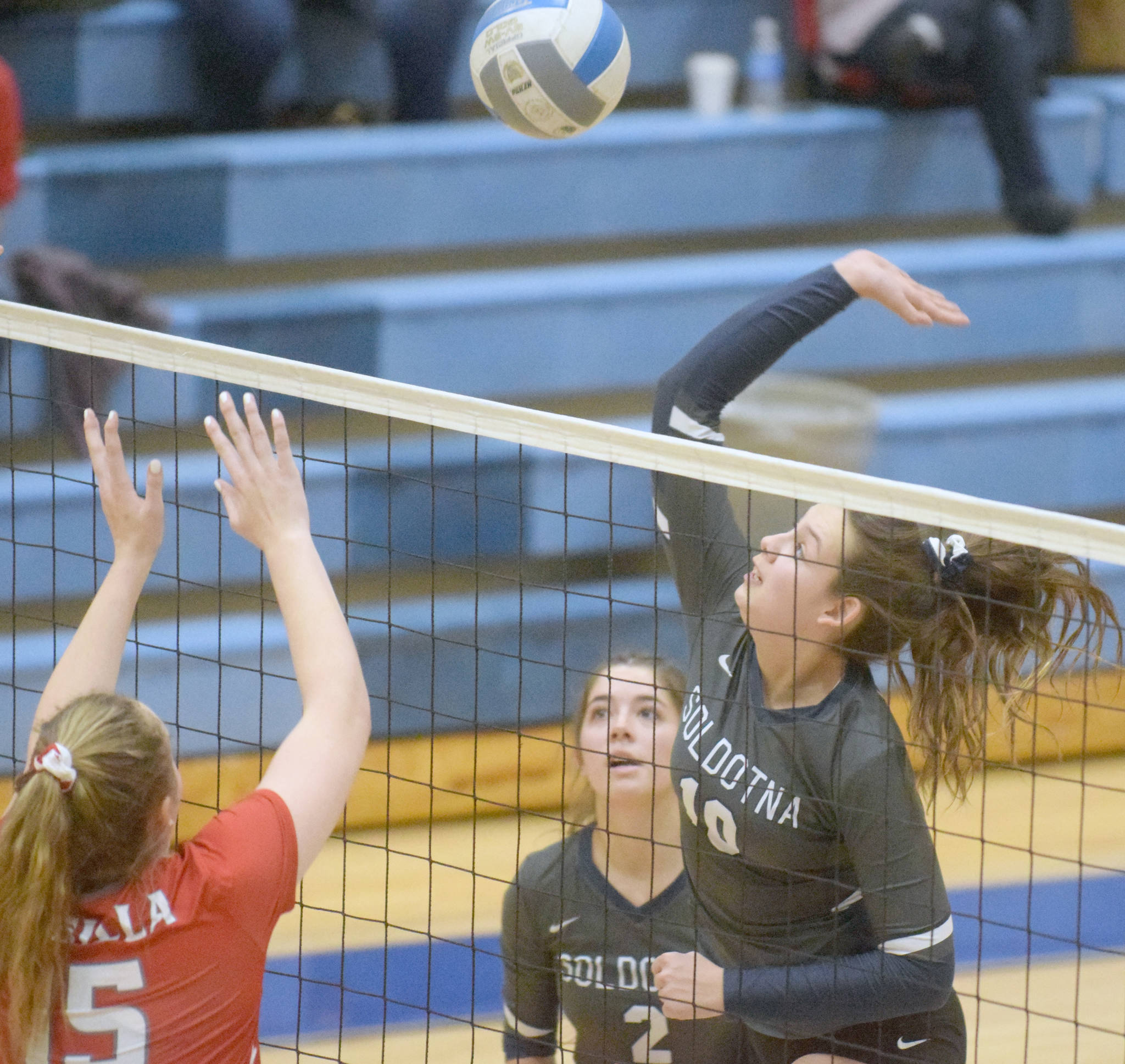 Soldotna’s Trayce Lyon attacks Wasilla’s Bella Hays at the Northern Lights Conference tournament at Soldotna High School on Saturday, Nov. 9, 2019, in Soldotna, Alaska. (Photo by Jeff Helminiak/Peninsula Clarion)