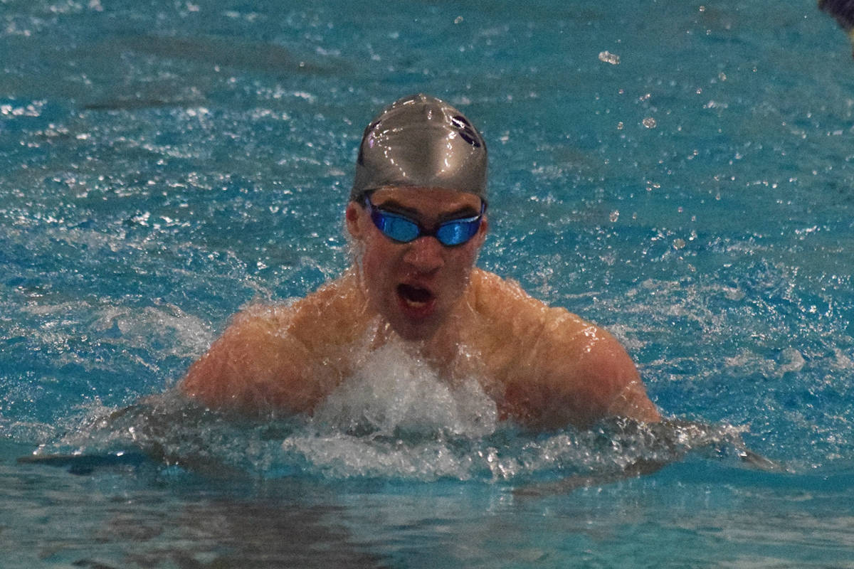 Soldotna’s Ethan Evans races in the boys 100-yard breaststroke final Saturday at the ASAA state swimming and diving championship at the Bartlett pool in Anchorage. (Photo by Joey Klecka/Peninsula Clarion)