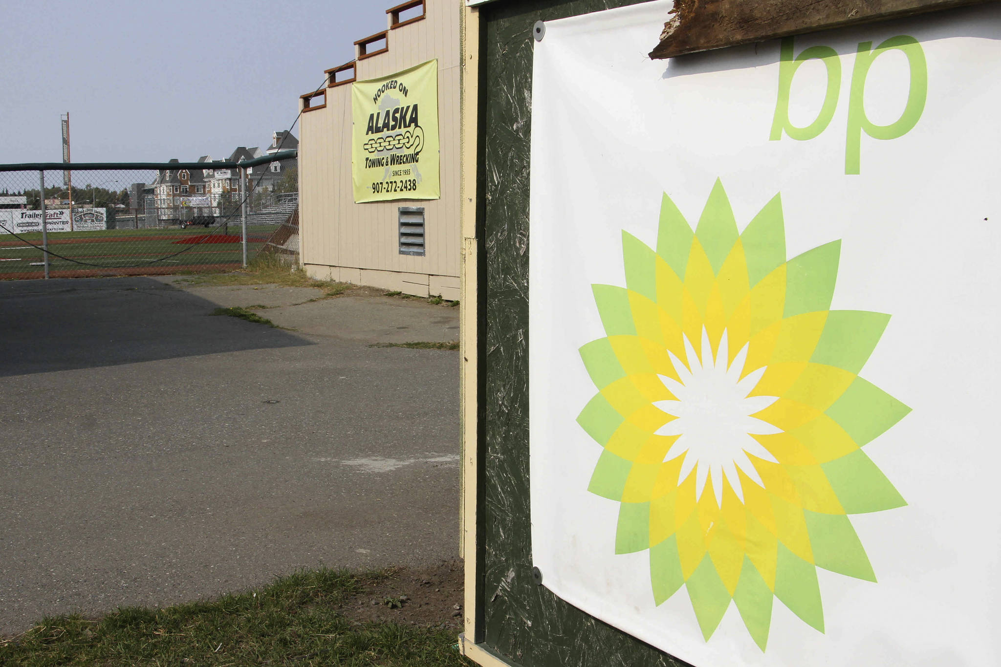 A BP sponsorship sign is shown at Mulcahy Stadium in Anchorage, Alaska, Wednesday, Aug. 28, 2019. BP announced plans Aug. 27, 2019, to sell its Alaska assets to Hilcorp, and its plan to pull out of Alaska could leave a big hole for nonprofits and other programs that benefited from the oil giant’s donations and its employee volunteers. (AP Photo/Mark Thiessen)