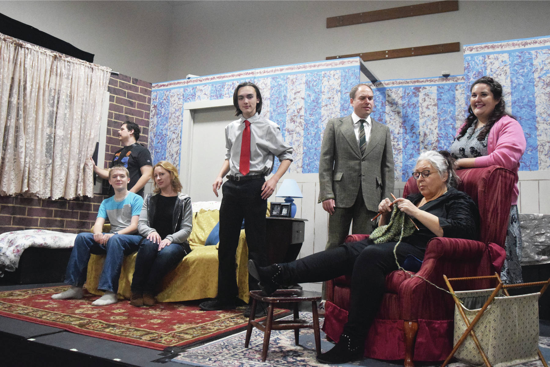 The cast of “Lost in Yonkers” poses before rehearsal Tuesday, Nov. 12, 2019, at the Kenai Performers stage in Soldotna, Alaska. (Photo by Joey Klecka/Peninsula Clarion)