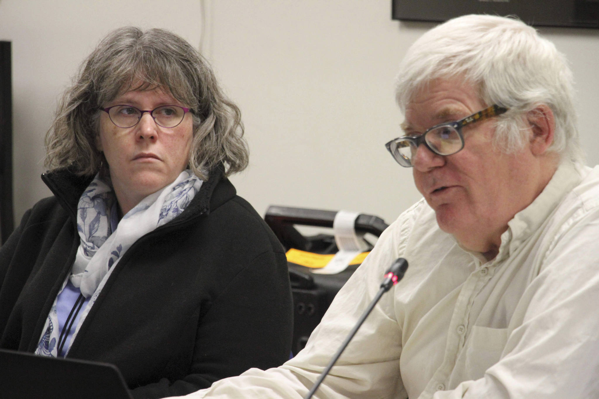Former Director of the state’s combined alcohol and marijuana control office Erika McConnell, left, sits with Marijuana board chairman Mark Springer in Anchorage, Alaska, on Wednesday, Nov. 13, 2019. The board that regulates Alaska’s legal marijuana industry voted to fire McConnell following last month’s vote by the Alcoholic Beverage Control Board to dismiss her. (AP Photo/Mark Thiessen)