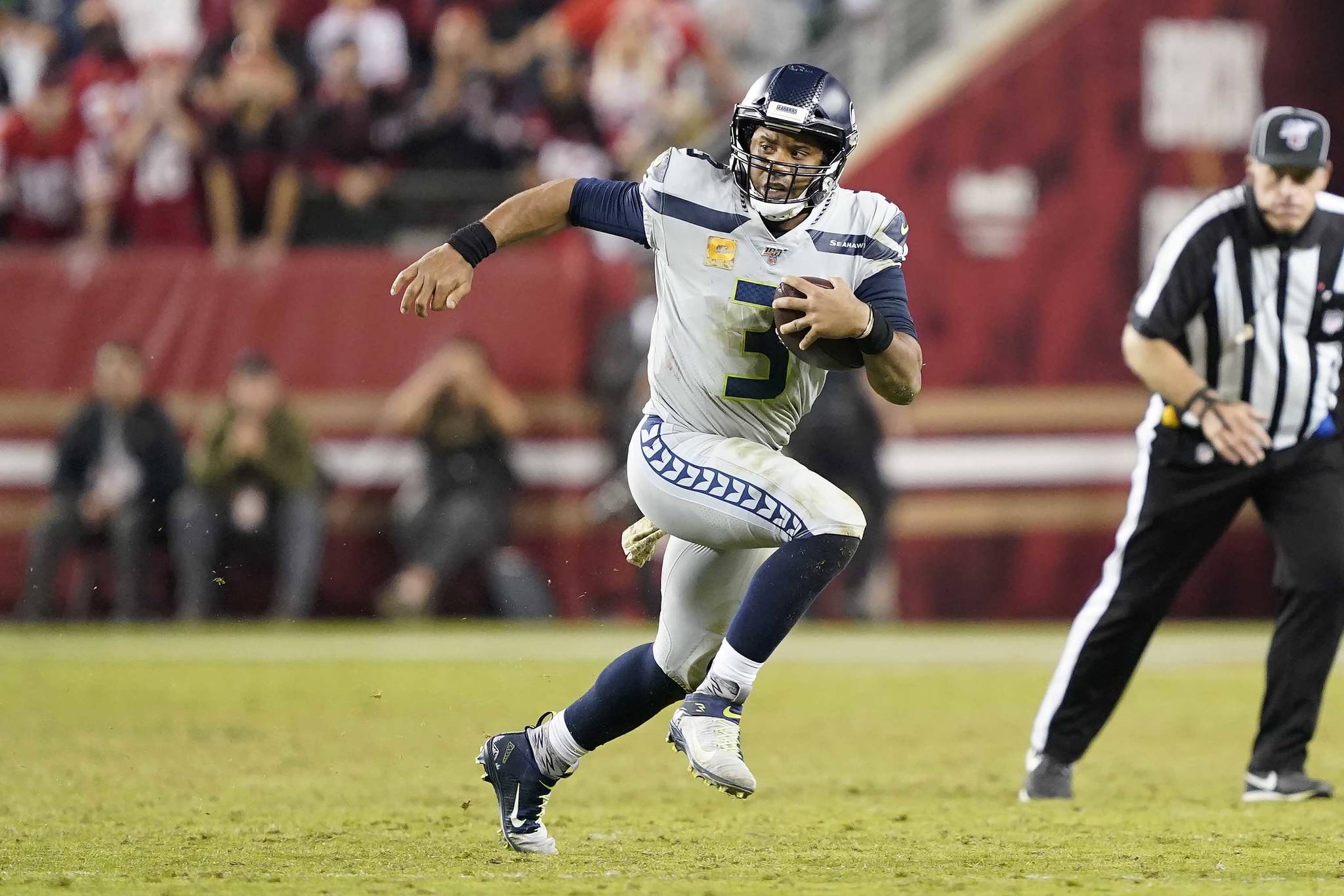 Seattle Seahawks quarterback Russell Wilson (3) runs against the San Francisco 49ers during an NFL football game in Santa Clara, Calif., Monday, Nov. 11, 2019. (AP Photo/Tony Avelar)