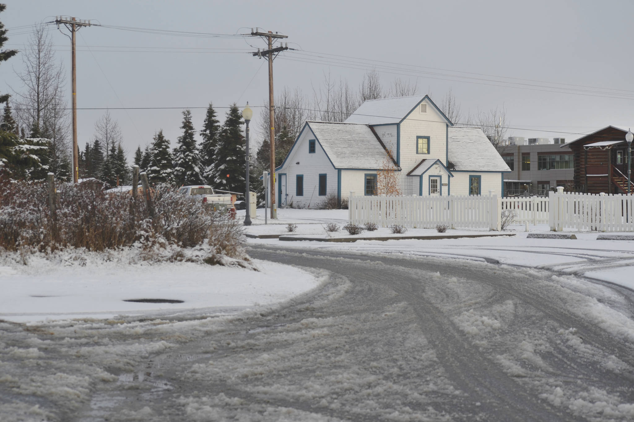 Old Town Kenai woke up to a blanket of snow Thursday morning, and by Thursday afternoon Petersen Way was slushy and wet, shown on Thursday, Nov. 14, 2019, in Kenai, Alaska. (Photo by Victoria Petersen/Peninsula Clarion)