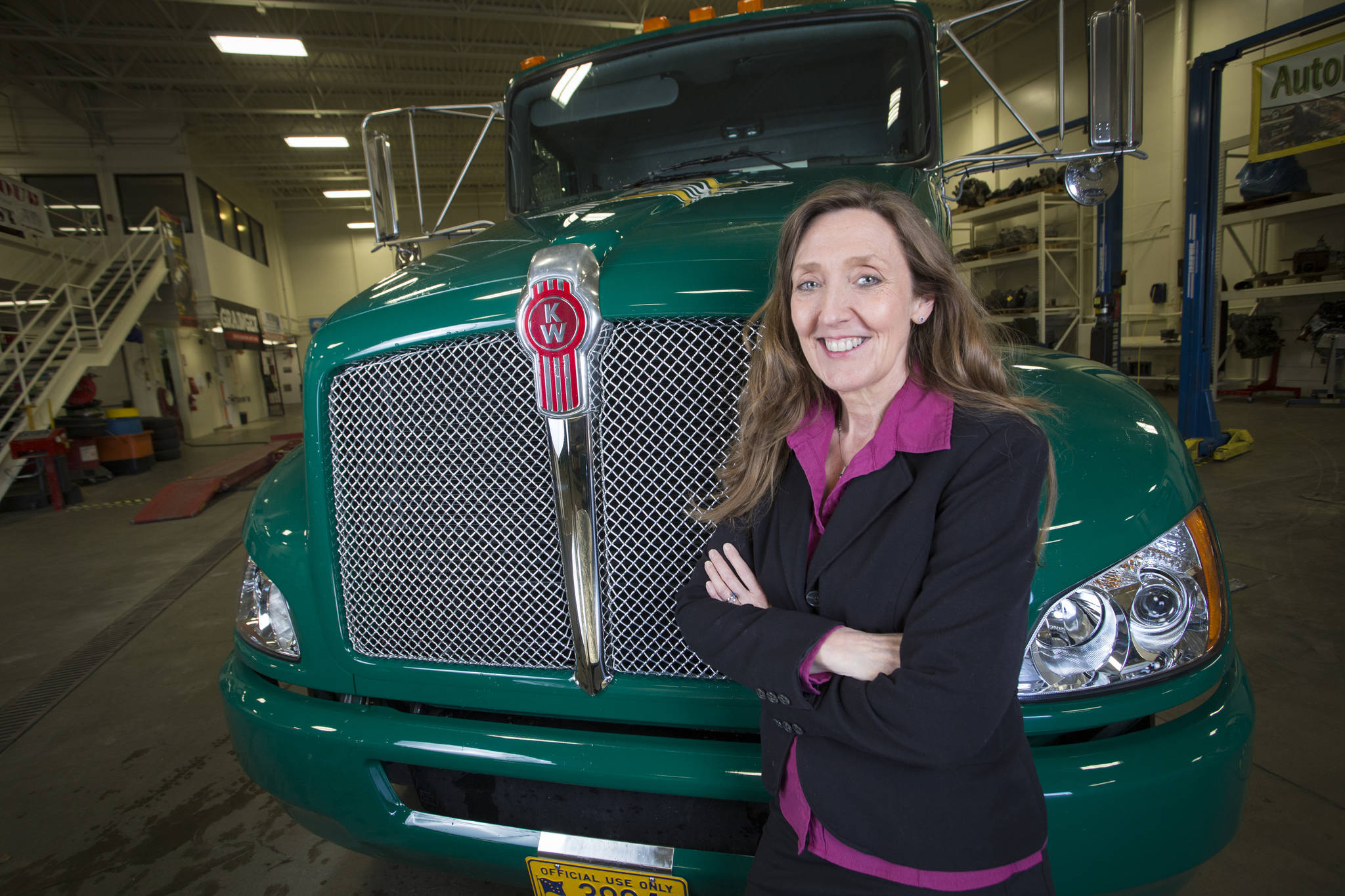 UAA’s Community Technical College Dean Denise Runge poses in the automotive lab. (Photo courtesy University of Alaska Anchorage)