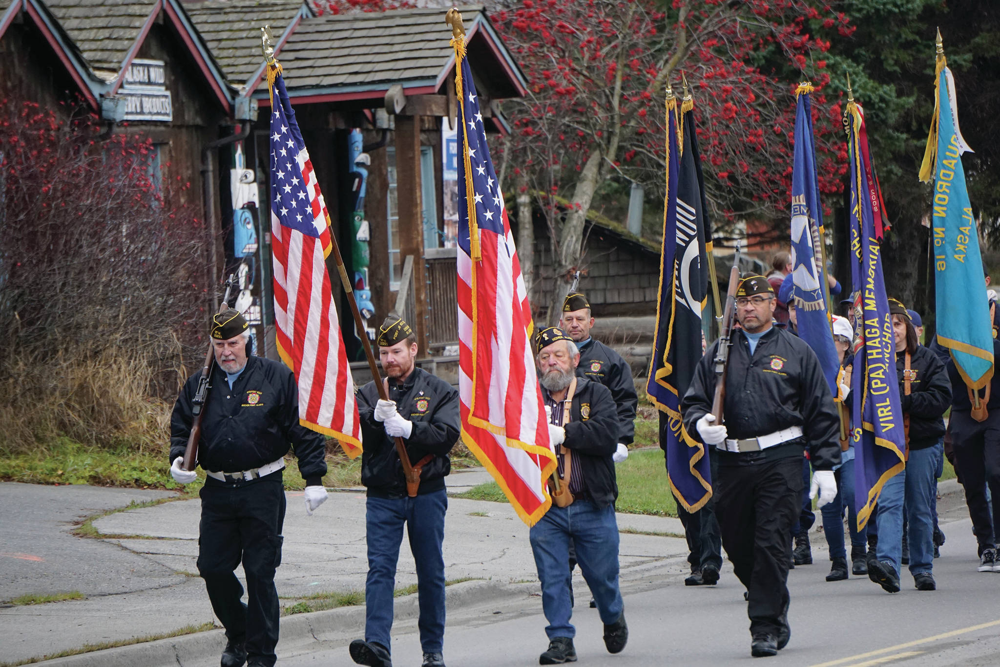 Members of the Veterans of Foreign Wars, Anchor Point Post, the American Legion Post 16 and the Sons of the American Legion Post 16 march on Pioneer Avenue in Veterans Day ceremonies on Nov. 11, 2019,in Homer, Alaska. (Photo by Michael Armstrong / Homer News)