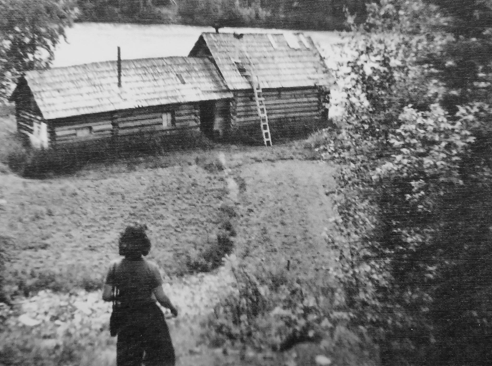 A friend of the two Jims approaches their cabin near Schooner Bend on the Kenai River, circa 1940s. (Photo courtesy of Mona Painter)