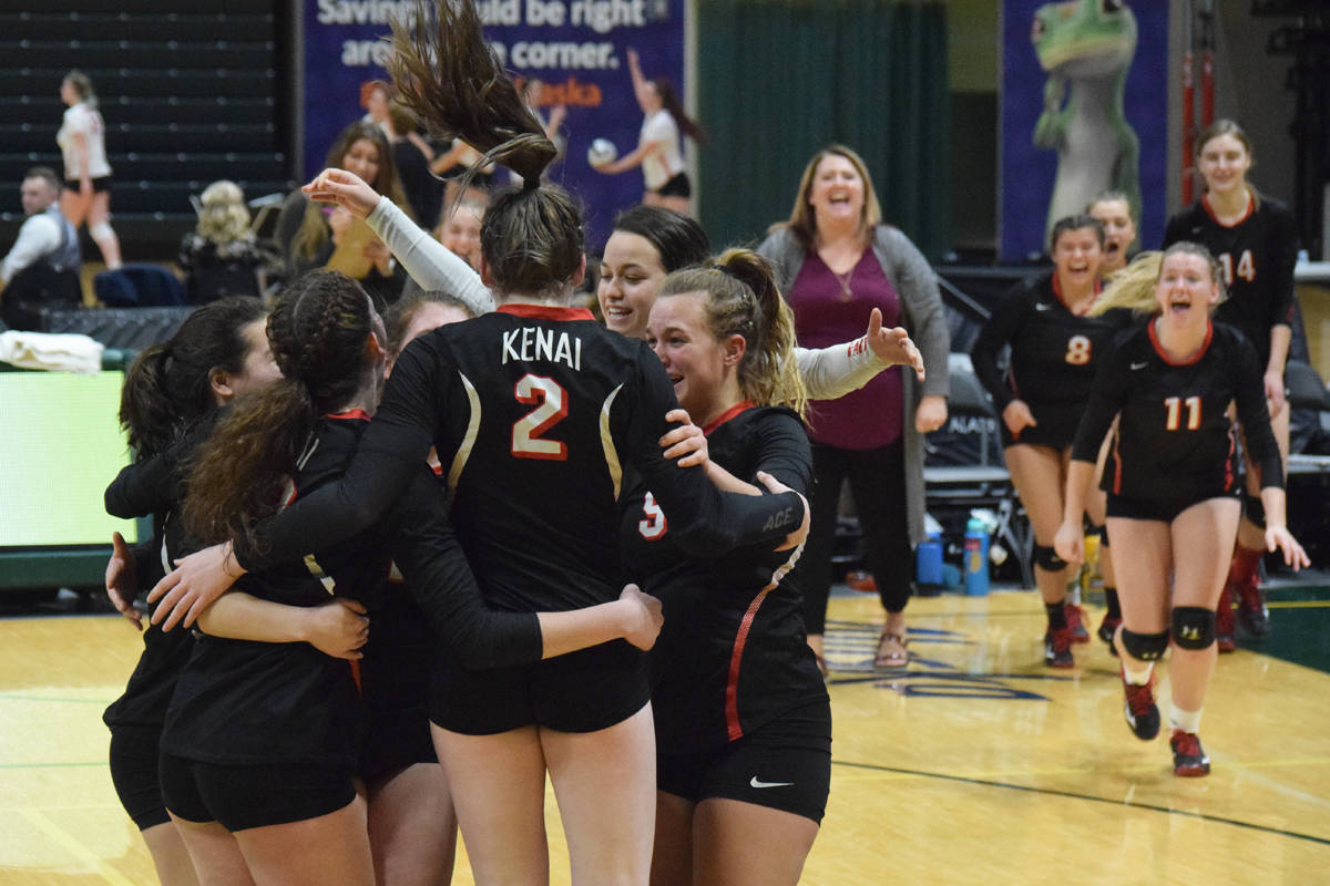 Kenai Central players celebrate after defeating Nikiski in a semifinal match Friday, Nov. 15, 2019, at the Class 3A state volleyball tournament at the Alaska Airlines Center in Anchorage, Alaska. (Photo by Joey Klecka/Peninsula Clarion)