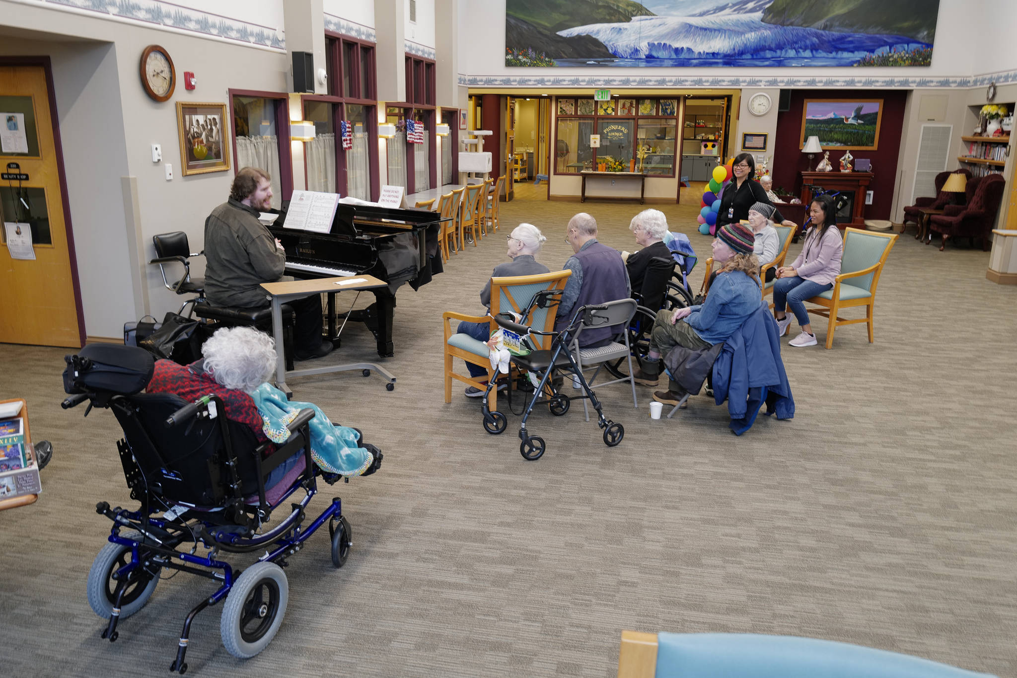 Volunteer Victor Carlisle sings and plays the piano for Juneau Pioneer Home residents on Friday, Nov. 15, 2019. (Michael Penn | Juneau Empire)