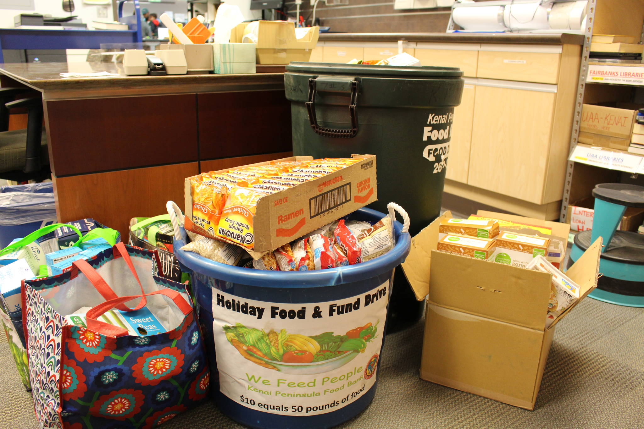 Food to be donated to the Kenai Peninsula Food Bank can be seen here at the Soldotna Public Library on Sept. 20, 2019. (Photo by Brian Mazurek/Peninsula Clarion)
