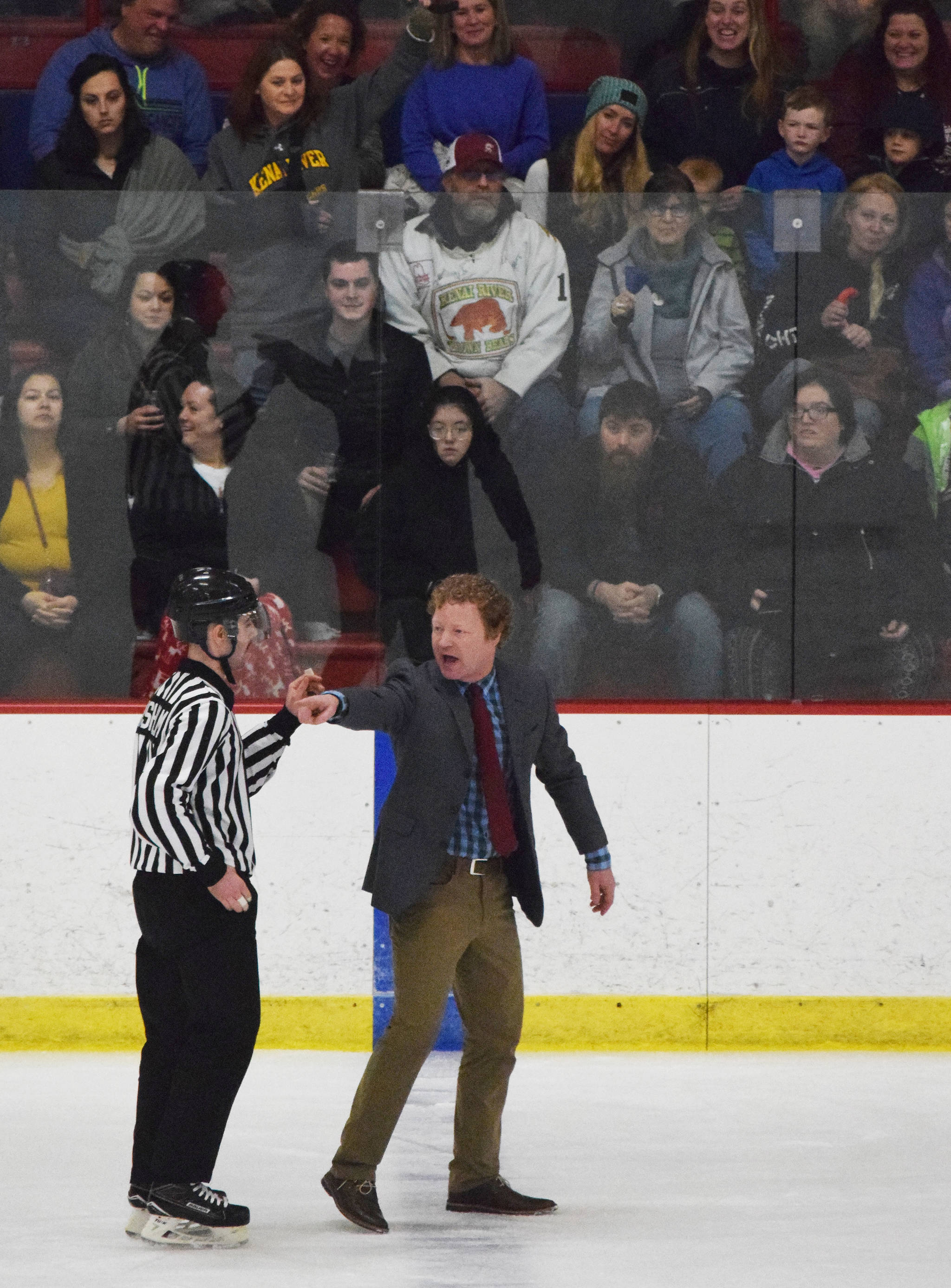 Fairbanks head coach Trevor Stewart argues a penalty call on the ice with a referee Saturday, Nov. 23, 2019, at the Soldotna Regional Sports Complex in Soldotna, Alaska. (Photo by Joey Klecka/Peninsula Clarion)