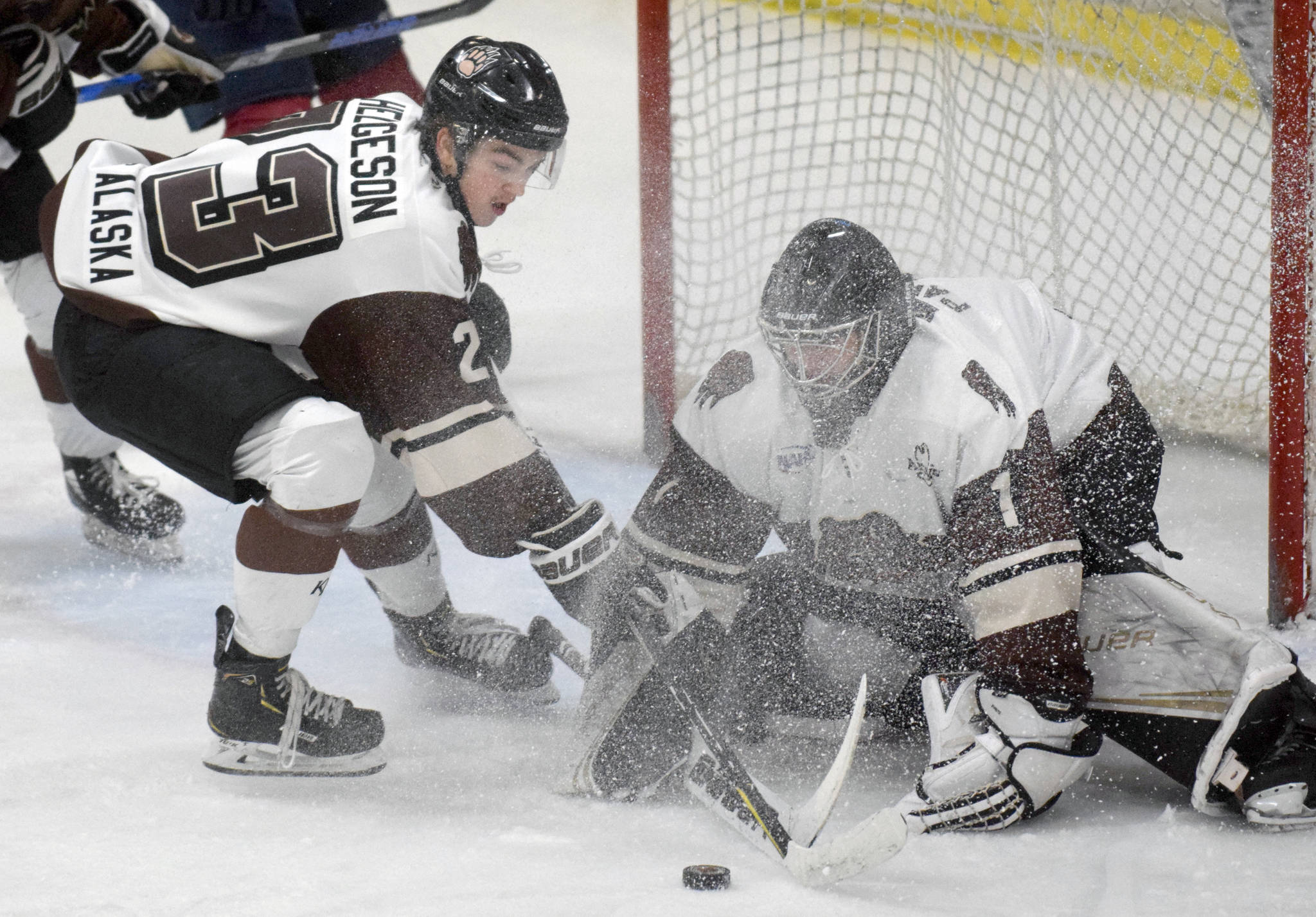 Kenai River Brown Bears forward Max Helgeson and goalie Landon Pavlisin keep the Fairbanks Ice Dogs from scoring Friday, Nov. 22, 2019, at the Soldotna Regional Sports Complex in Soldotna, Alaska. (Photo by Jeff Helminiak/Peninsula Clarion)