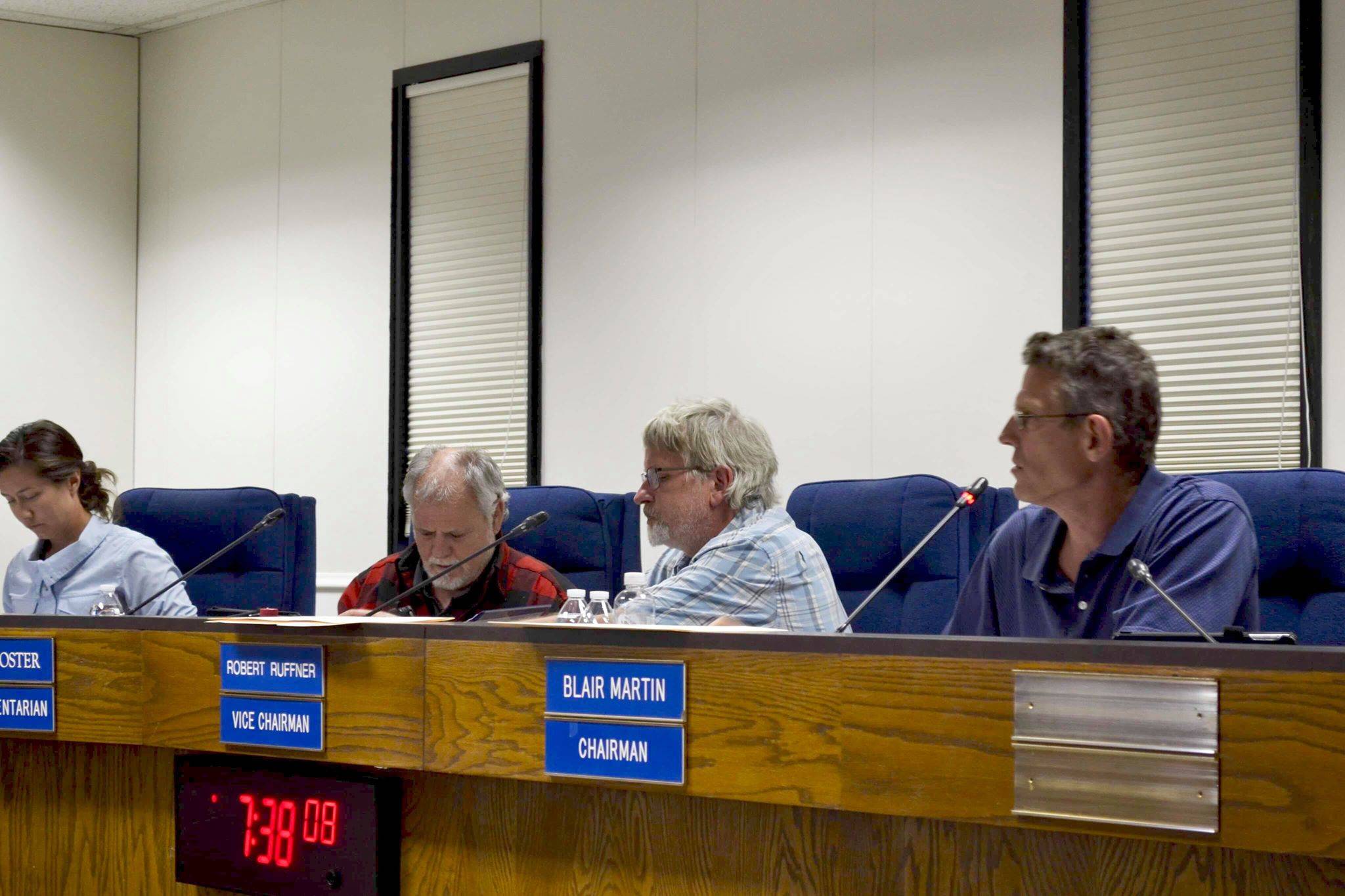Kenai Peninsula Borough Planning Commission Chairman Blair Martin, Vice Chairman Robert Ruffner and Parliamentarian Rick Foster facilitate discussions on a gravel pit permit application on Monday, June 24, 2019, in Soldotna, Alaska. (Photo by Victoria Petersen/Peninsula Clarion)