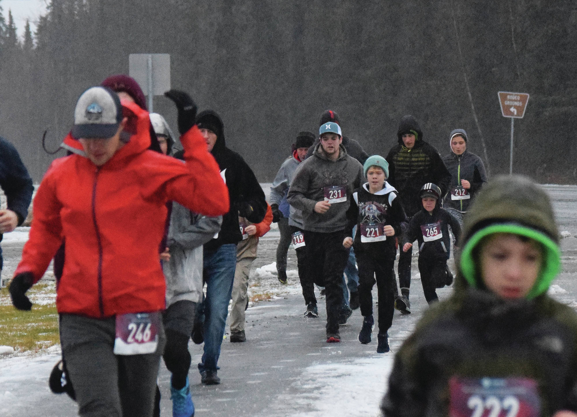 Runners stream down the Unity Trail early Thursday, Nov. 28, 2019, at the Turkey Trot in Soldotna, Alaska. (Photo by Joey Klecka/Peninsula Clarion)