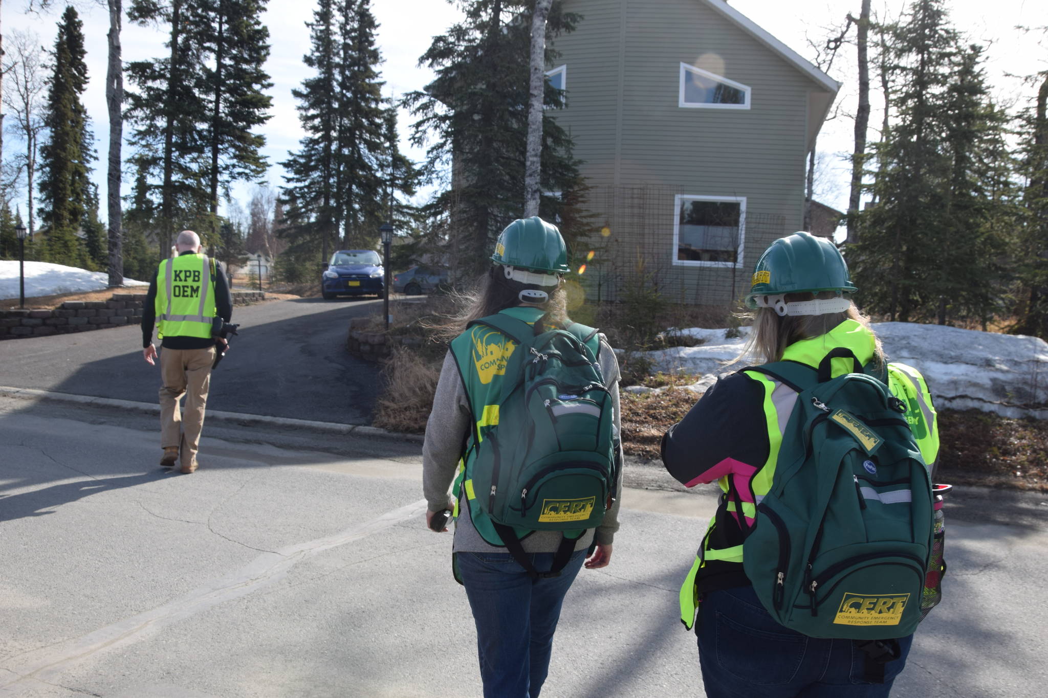 CERT volunteers go door to door while simulating a neighborhood evacuation in Kenai, Alaska, during OEM’s Alaska Shield 2019 program on April 13, 2019. (Photo by Brian Mazurek/Peninsula Clarion)