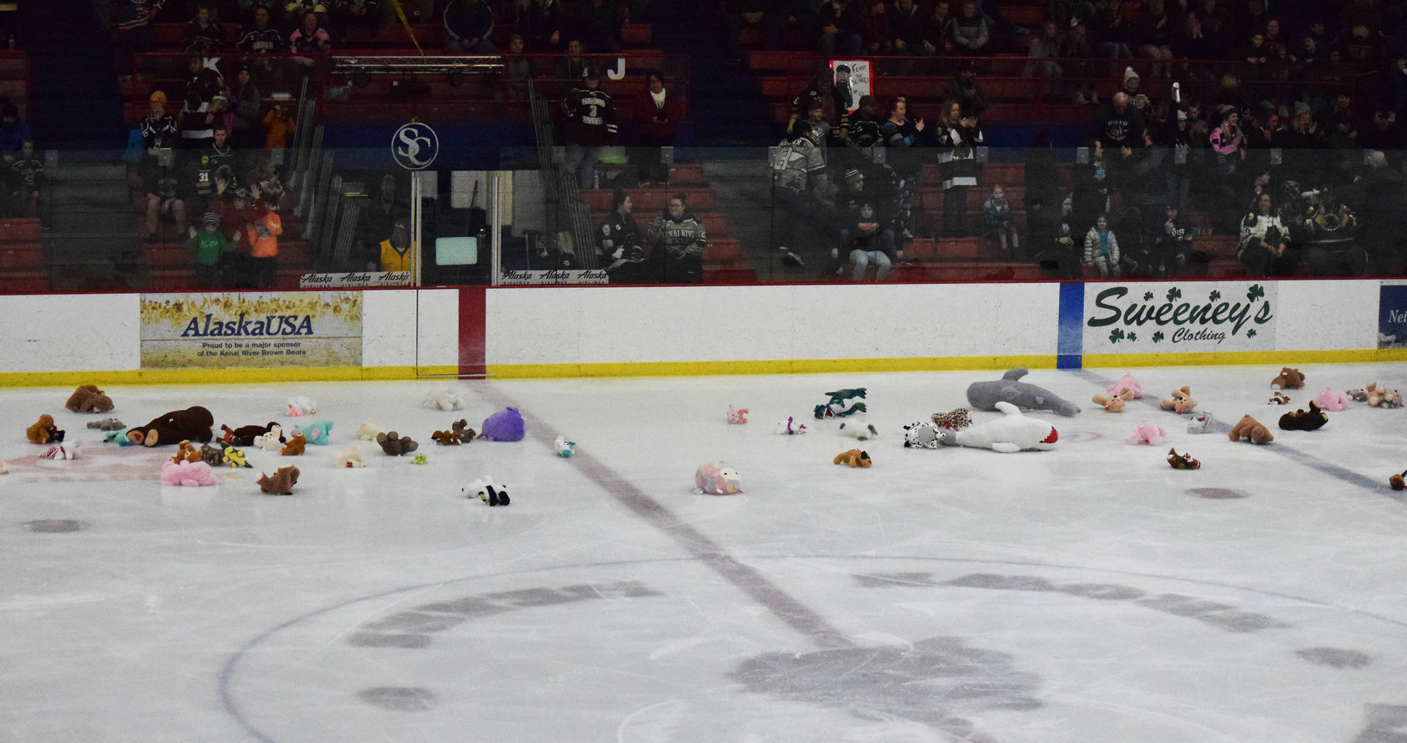 Toy animals litter the ice Friday, Nov. 29, 2019, after fans participated in a charity toss following the first goal of the game between the Kenai River Brown Bears and the Minnesota Magicians at the Soldotna Regional Sports Complex in Soldotna, Alaska. (Photo by Joey Klecka/Peninsula Clarion)