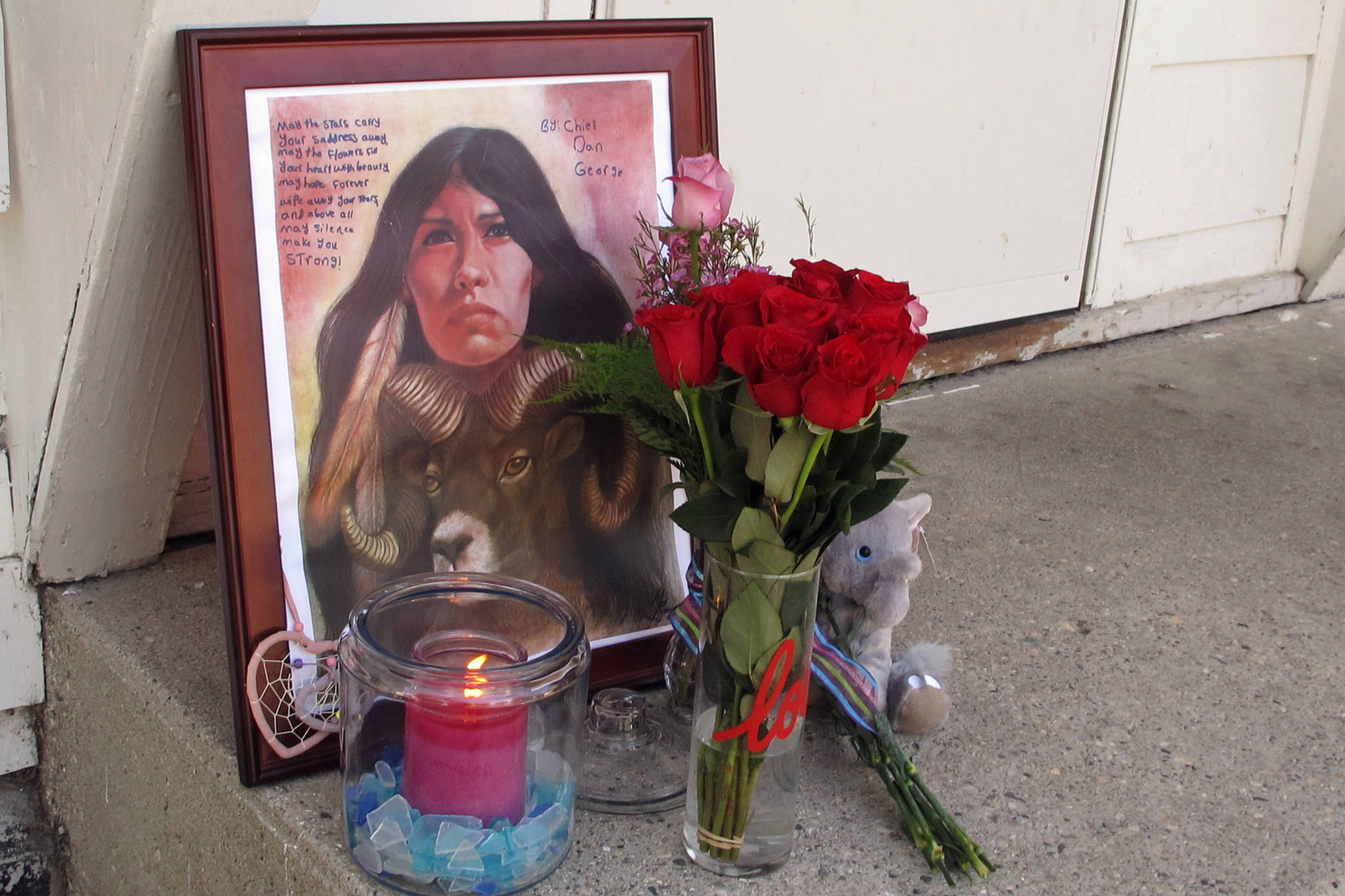 A makeshift memorial to Savanna Greywind featuring a painting, flowers, candle and a stuffed animal is seen on Monday, Aug. 28, 2017, in Fargo, N.D., outside the apartment where Greywind lived with her parents. Republican U.S. Sen. Lisa Murkowski from Alaska is taking up the cause for a bill aimed at helping law enforcement with cases of murdered and missing indigenous women. Former North Dakota Democratic Sen. Heidi Heitkamp introduced and helped pass Savanna’s Act in the Senate before she lost election, but it was blocked in the House by a retiring Republican. (AP Photo/Dave Kolpack, File)