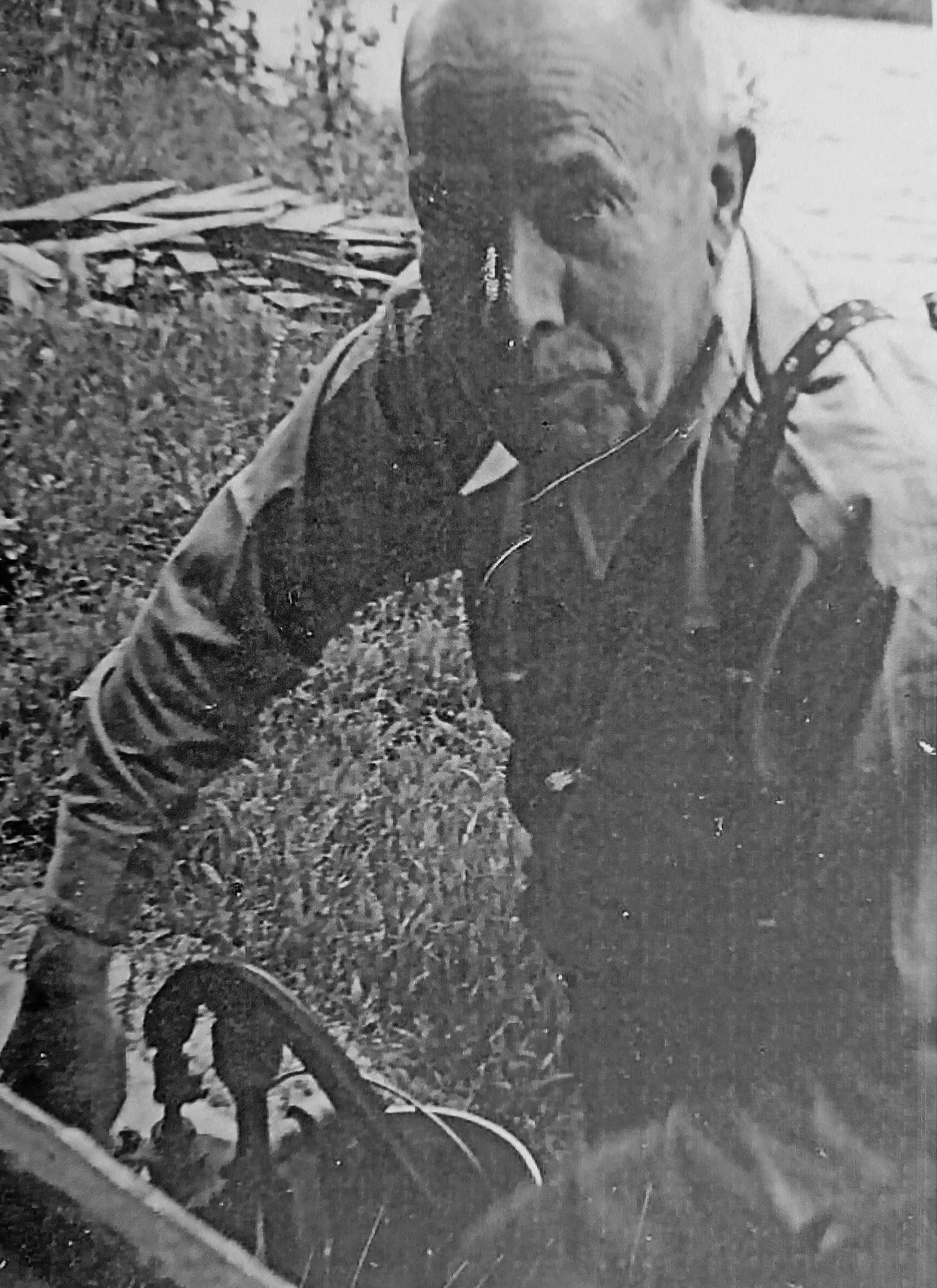 Big Jim works the water pump at his home near Schooner Bend on the Kenai River, circa late 1950s. (Photo courtesy of Mona Painter)