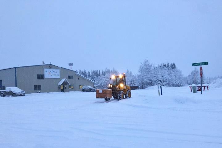 A heavy duty forklift travels on Kenai’s snowy streets after winter weather brought heavy snow to the western Kenai Peninsula on Sunday and Monday, on Monday, Dec. 2, 2019. (Photo by Victoria Petersen/Peninsula Clarion)