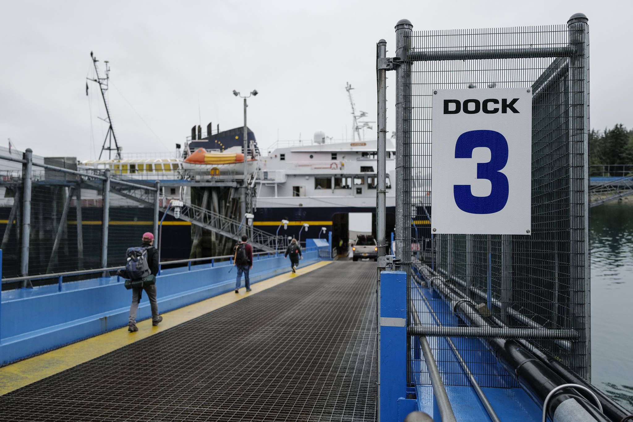 Walk-on passengers and vehicles load onto the LeConte ferry for a trip to Hoonah and Gustavus at the Alaska Marine Highway System’s Auke Bay Terminal on Friday, July 19, 2019. (Michael Penn | Juneau Empire File)