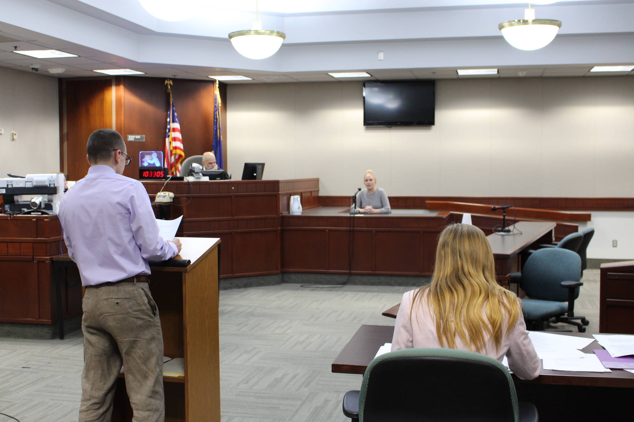 Nikiski Middle/High School senior Joseph Yourkoski, in his role as prosecutor, questions witness Cecily Quiner during a mock trial at the Kenai Courthouse on Dec. 3, 2019. (Photo by Brian Mazurek/Peninsula Clarion)