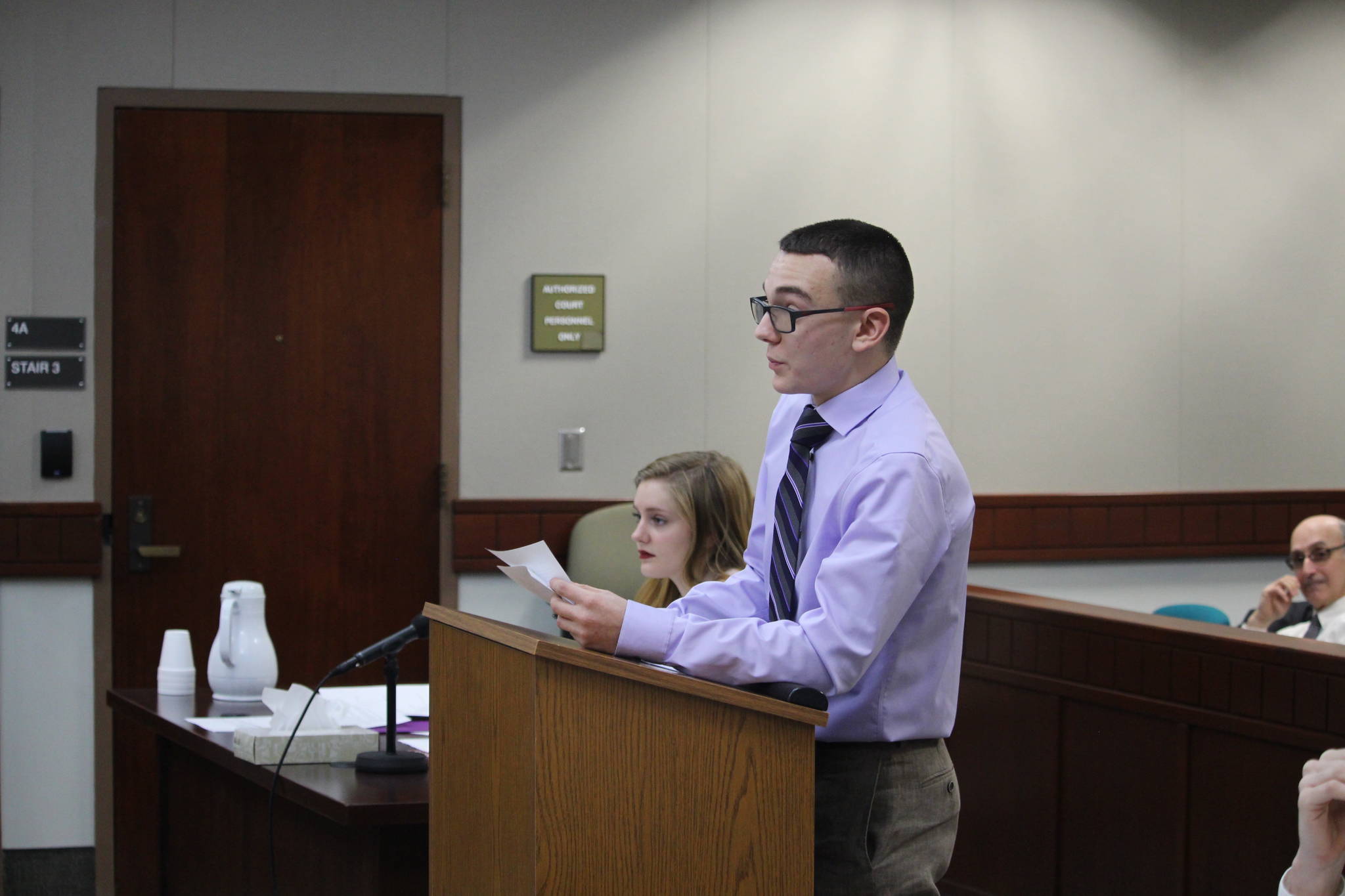 Nikiski Middle/High School senior Joseph Yourkoski, in his role as prosecutor, questions a witness during a mock trial at the Kenai Courthouse on Dec. 3, 2019. (Photo by Brian Mazurek/Peninsula Clarion)