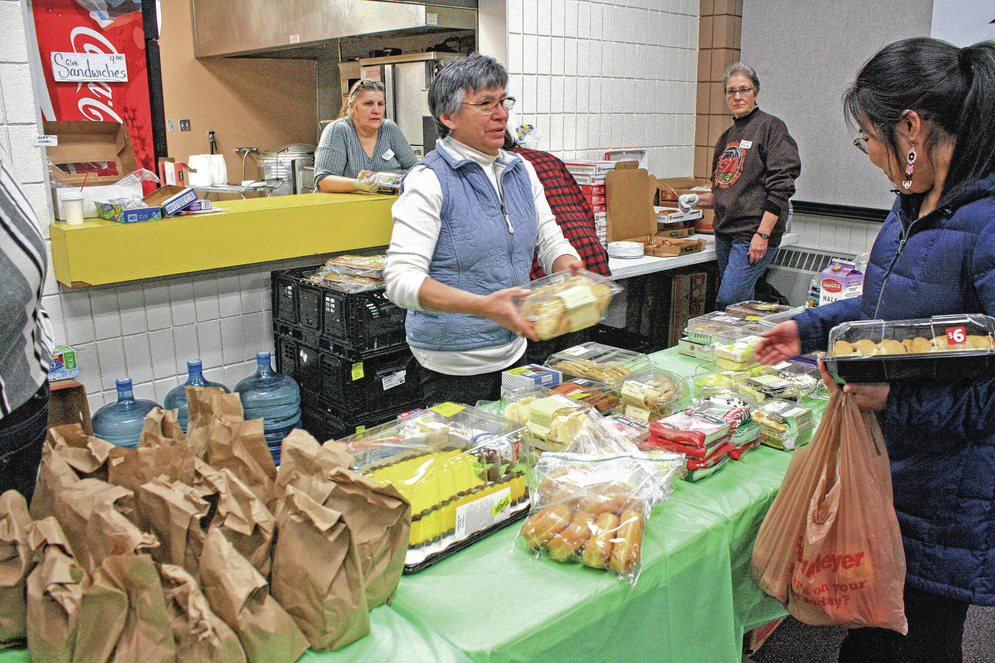 Erin Thompson / Peninsula Clarion                                Volunteers staff the kitchen and buffet line for Project Homeless Connect at the Soldotna Regional Sports Complex on Jan. 24, 2018. The annual event gathers service providers, nonprofits and volunteers to support members of the homeless community and those in need.