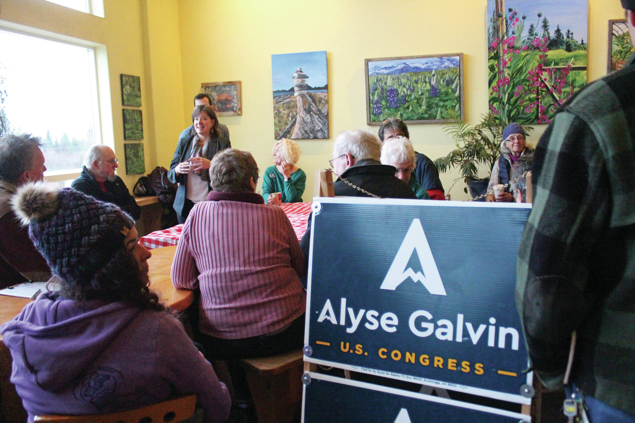 Community members listen to Alyse Galvin, who is running for the Alaska seat in the U.S. House of Representatives, speak during a meet and greet Sunday. Dec. 1, 2019 at K-Bay Caffee in Homer, Alaska. Galvin first ran to unseat Rep. Don Young in 2018. (Photo by Megan Pacer/Homer News)