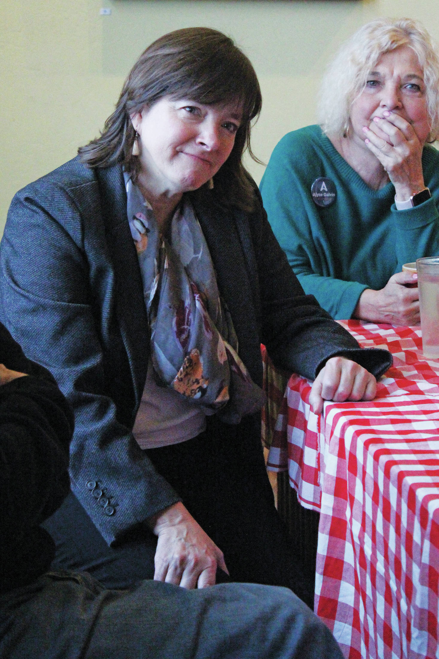Alyse Galvin, who is running for the Alaska seat in the U.S. House of Representatives, listens to a community member speak during a meet and greet Sunday. Dec. 1, 2019 at K-Bay Caffee in Homer, Alaska. Galvin first ran to unseat Rep. Don Young in 2018. (Photo by Megan Pacer/Homer News)