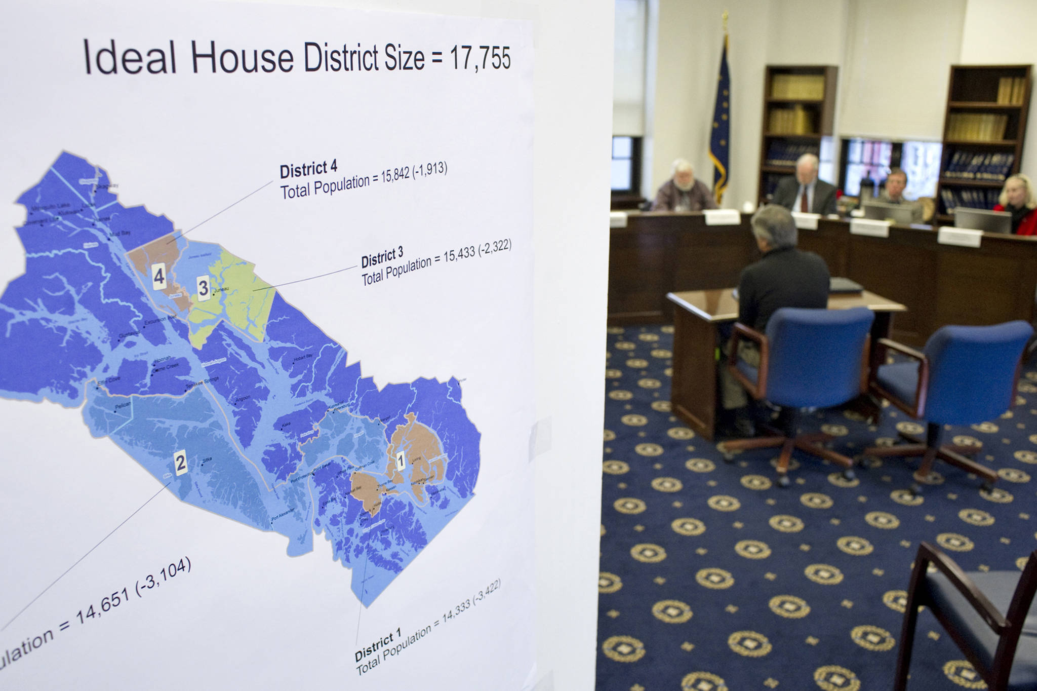 In this file photo, a House district map shows district population numbers as the Alaska Redistricting Board hears testimony at the Capitol on Friday, March 25, 2011. (Juneau Empire File)