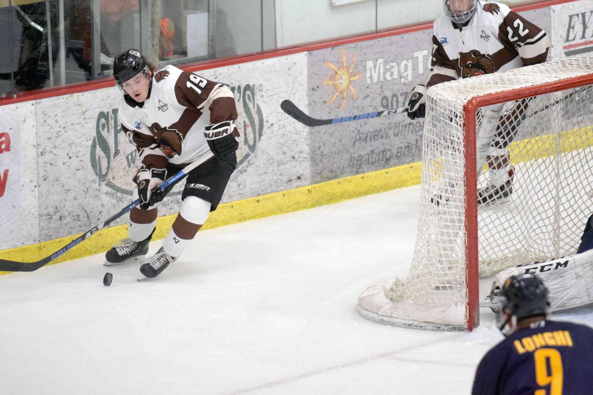 Kenai River Brown Bears forward Cody Moline carries the puck behind the net against the Springfield (Illinois) Jr. Blues on Friday, Nov. 15, 2019, at the Soldotna Regional Sports Complex. (Photo by Jeff Helminiak/Peninsula Clarion)