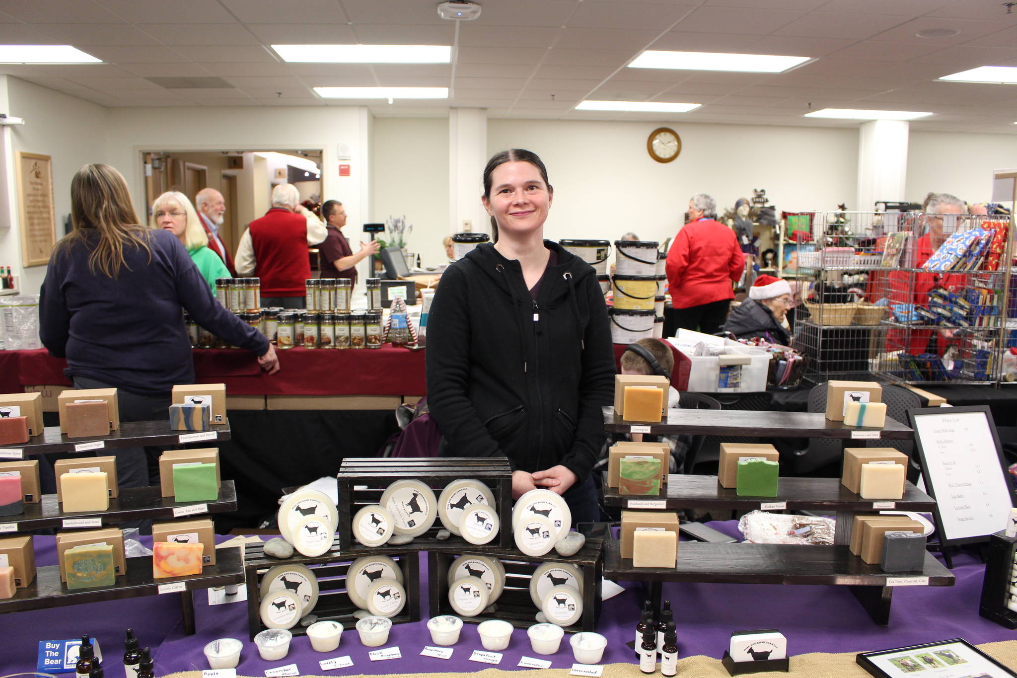 Meg Wright, owner of Wise and Right Farm, displays some of her goat milk soap for sale at the annual Central Peninsula Hospital Auxiliary Holiday Bazaar in Soldotna, Alaska on Dec. 6, 2019. (Photo by Brian Mazurek/Peninsula Clarion)